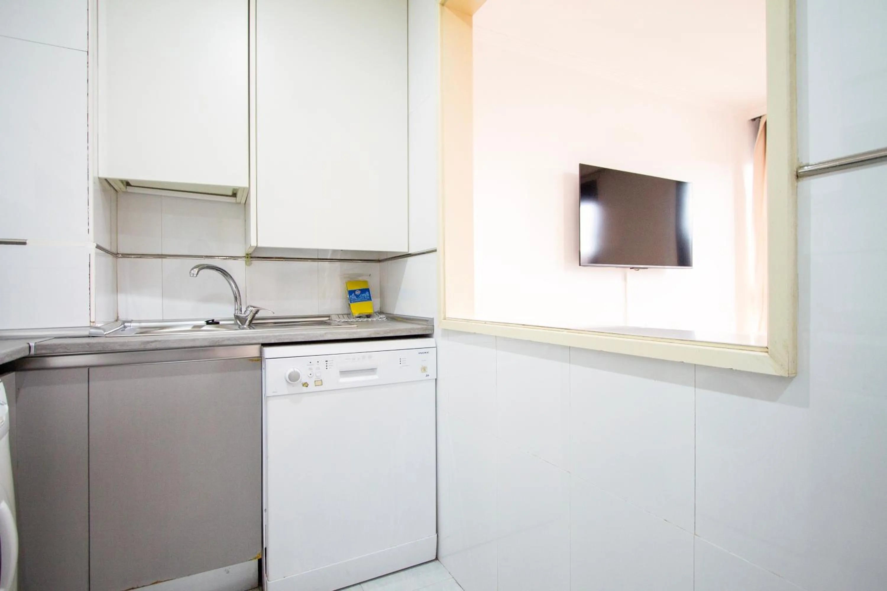 Kitchen or kitchenette in Apartamentos Cinco Rosas