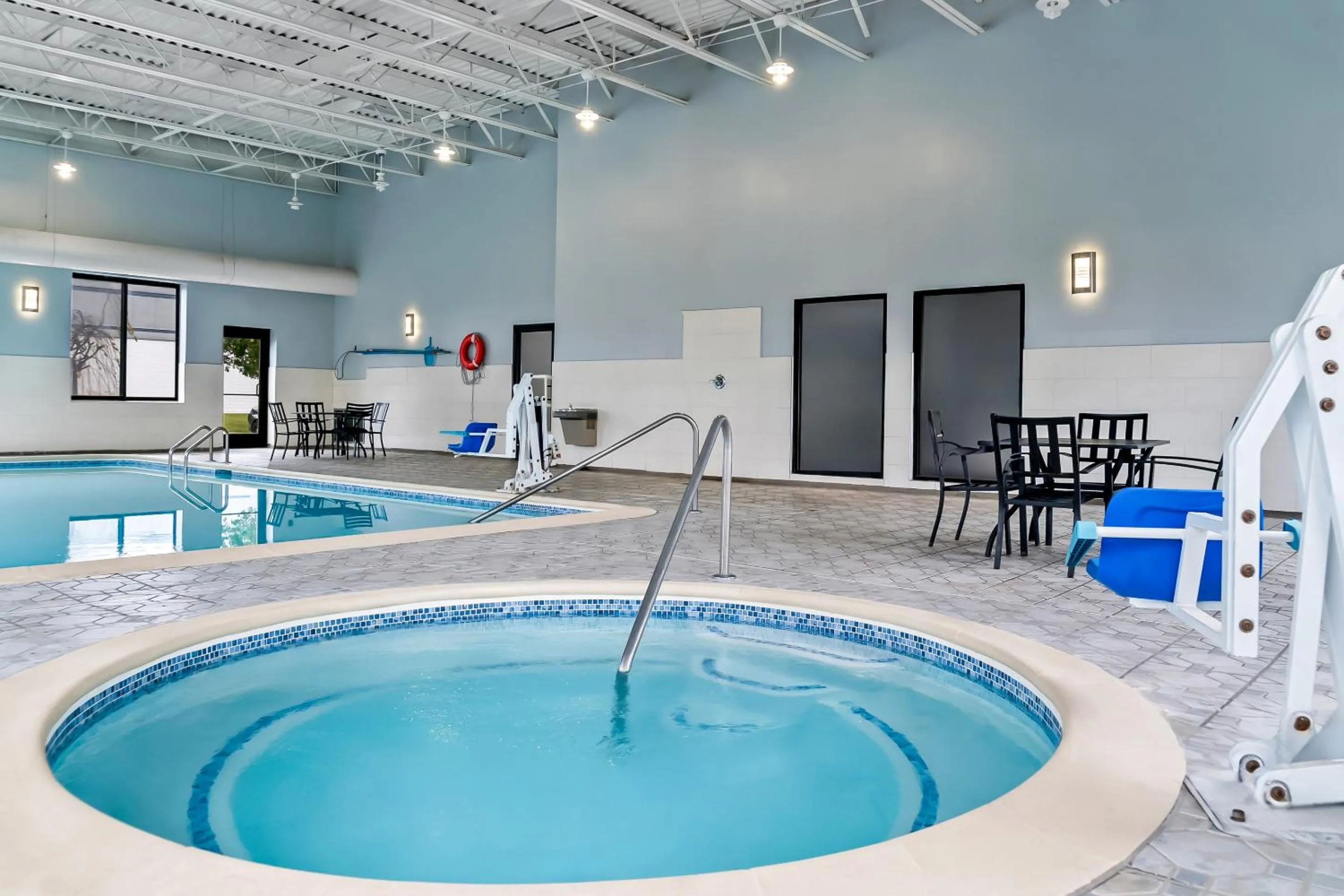 Swimming pool in HomeTowne Studios by Red Roof Flint