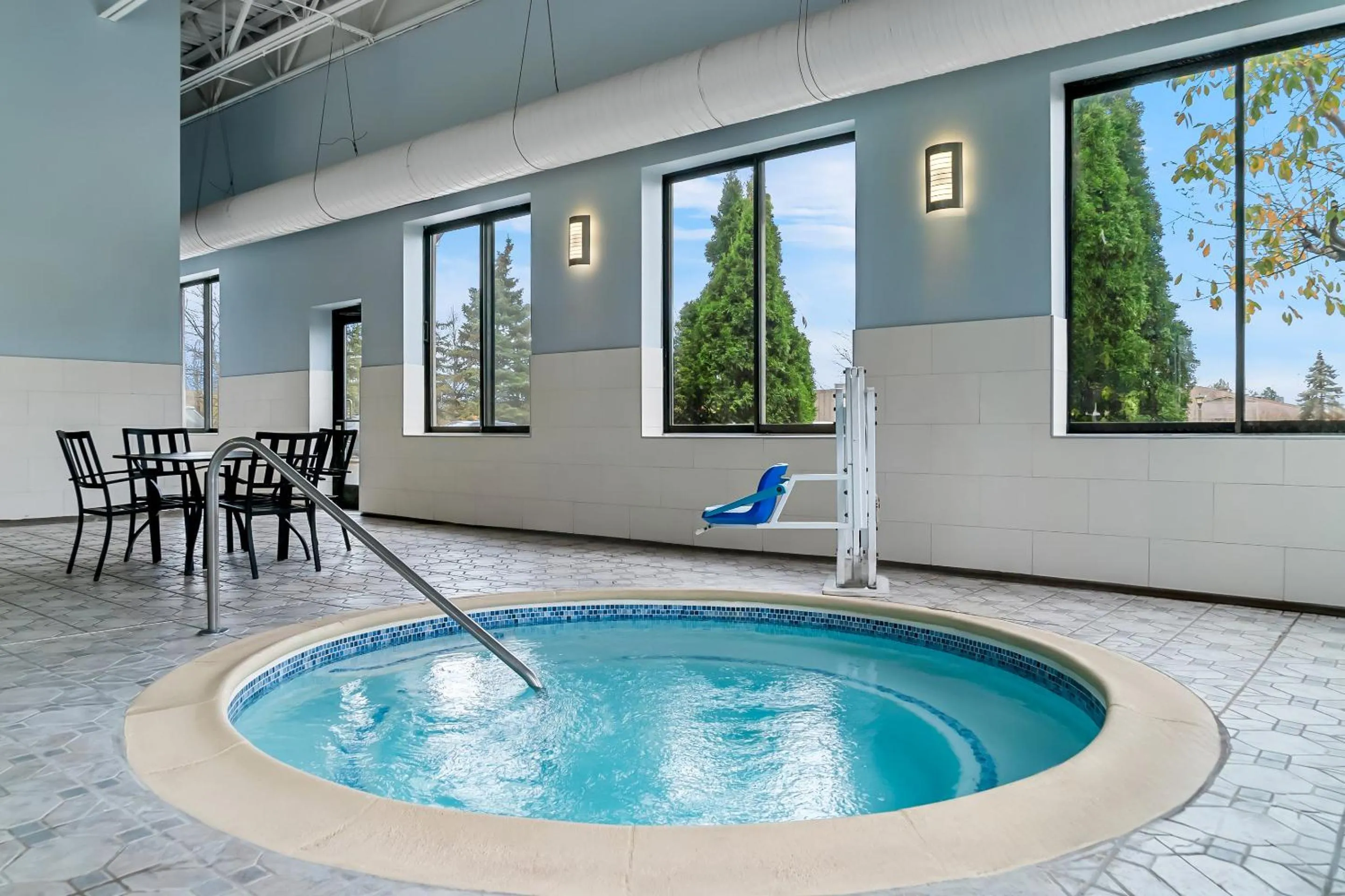 Swimming pool in HomeTowne Studios by Red Roof Flint