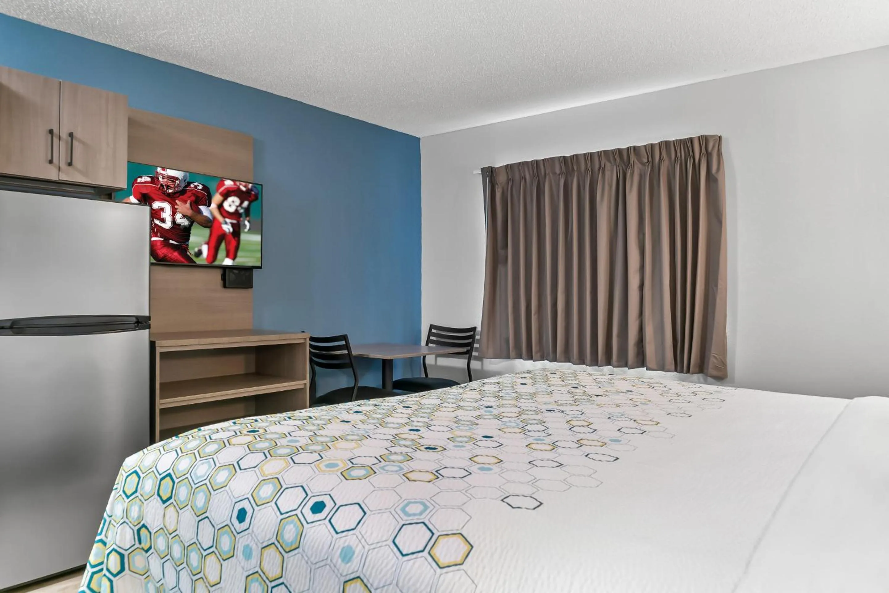 Photo of the whole room, Bed in HomeTowne Studios by Red Roof Flint