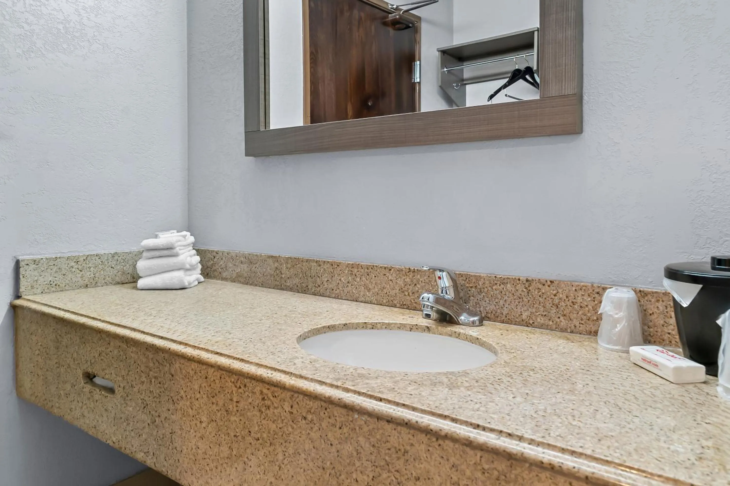 Bathroom in HomeTowne Studios by Red Roof Flint
