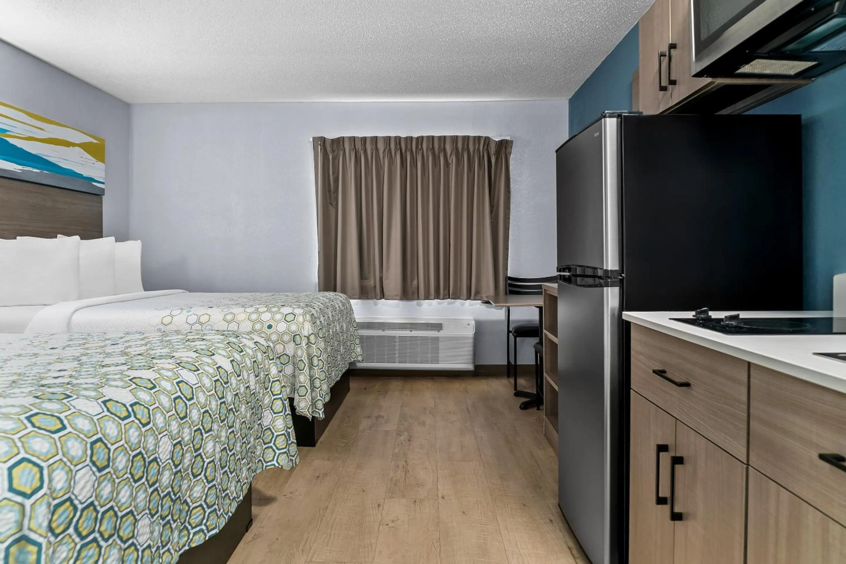 Photo of the whole room, Bed in HomeTowne Studios by Red Roof Flint