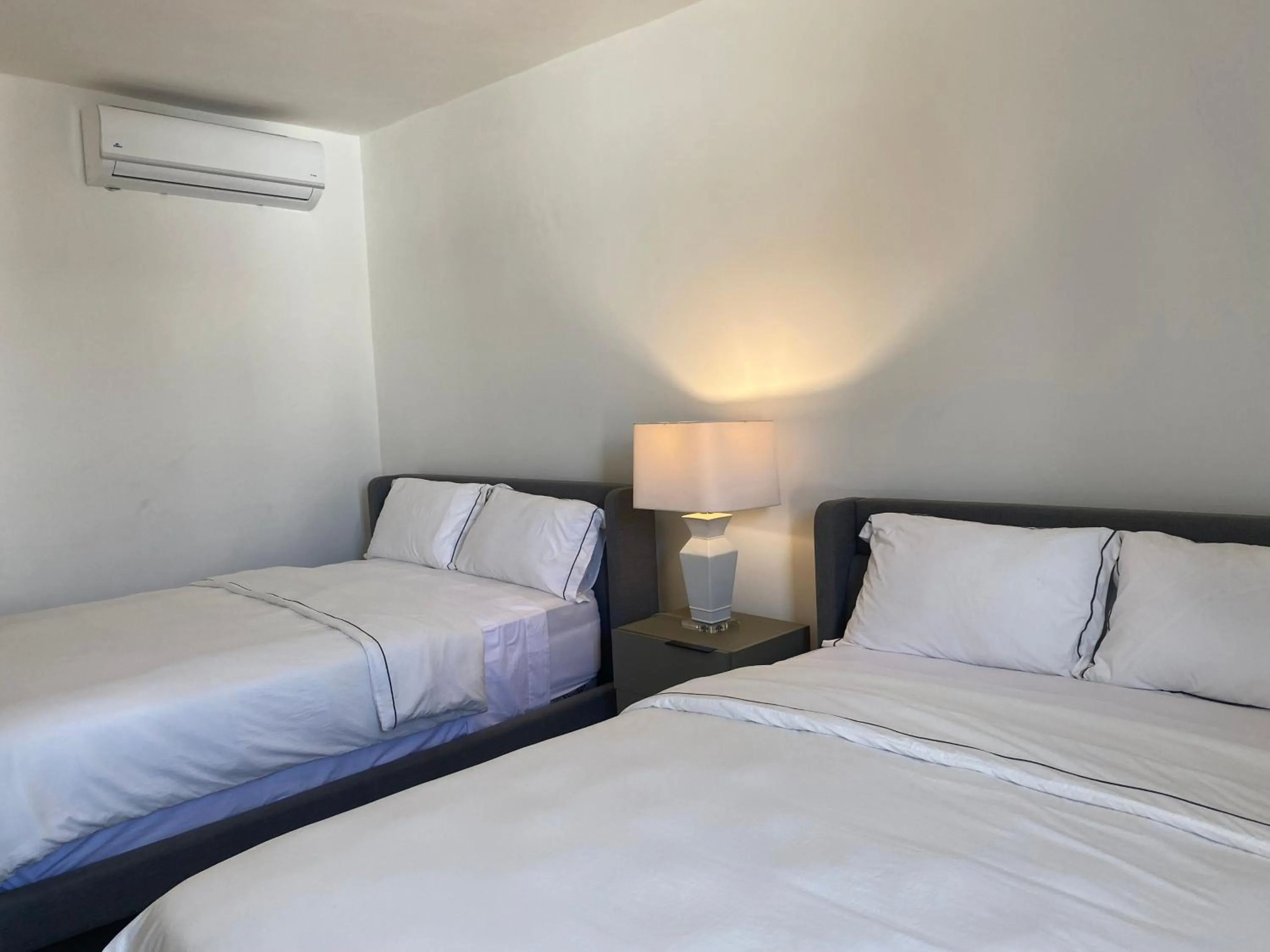 Bed in The Palm Bay Club Lodge