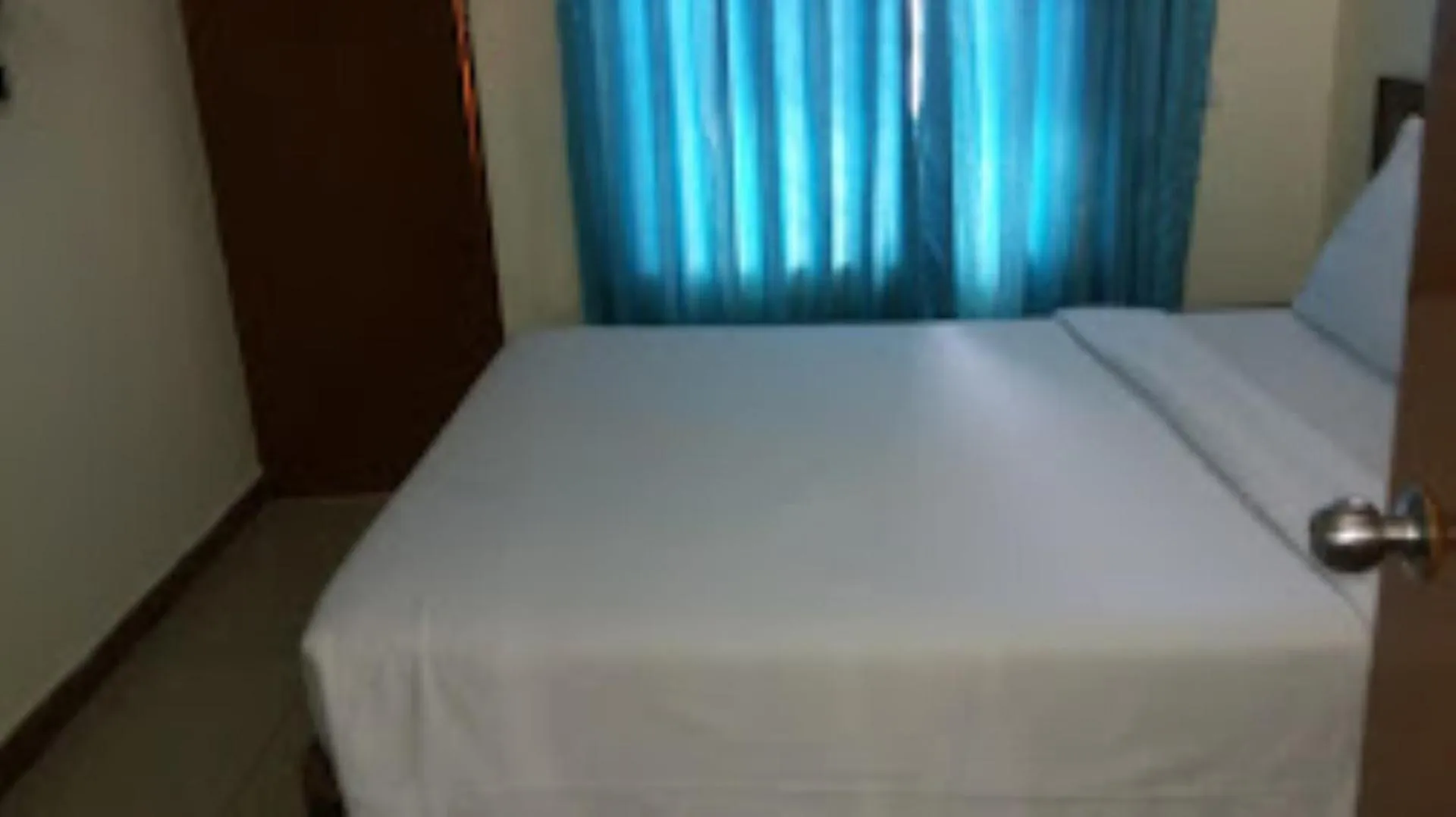 Bed in Blue Lily Beach Resort