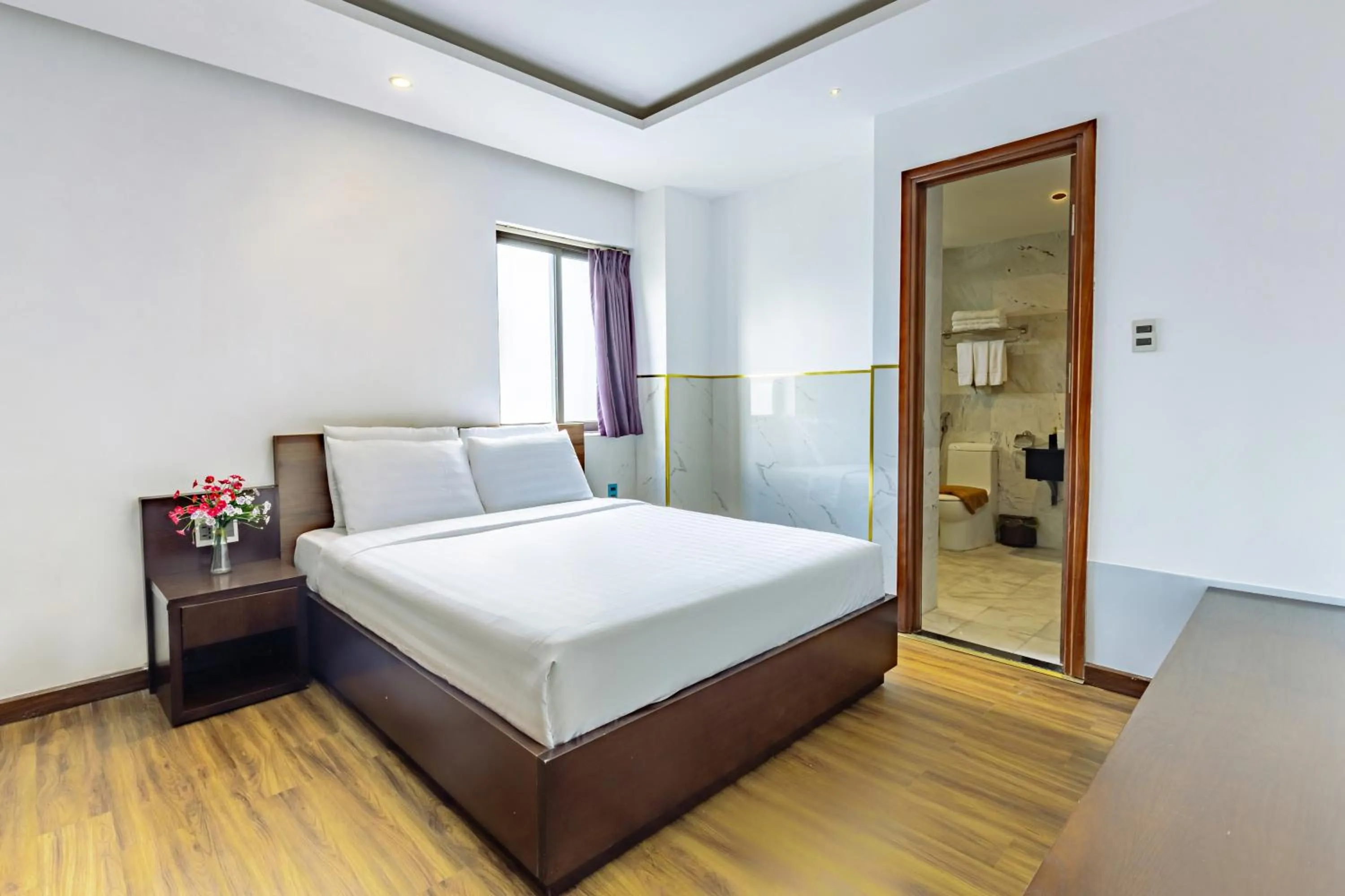 Bed in Golden Sun Apartment by New Sky Travel