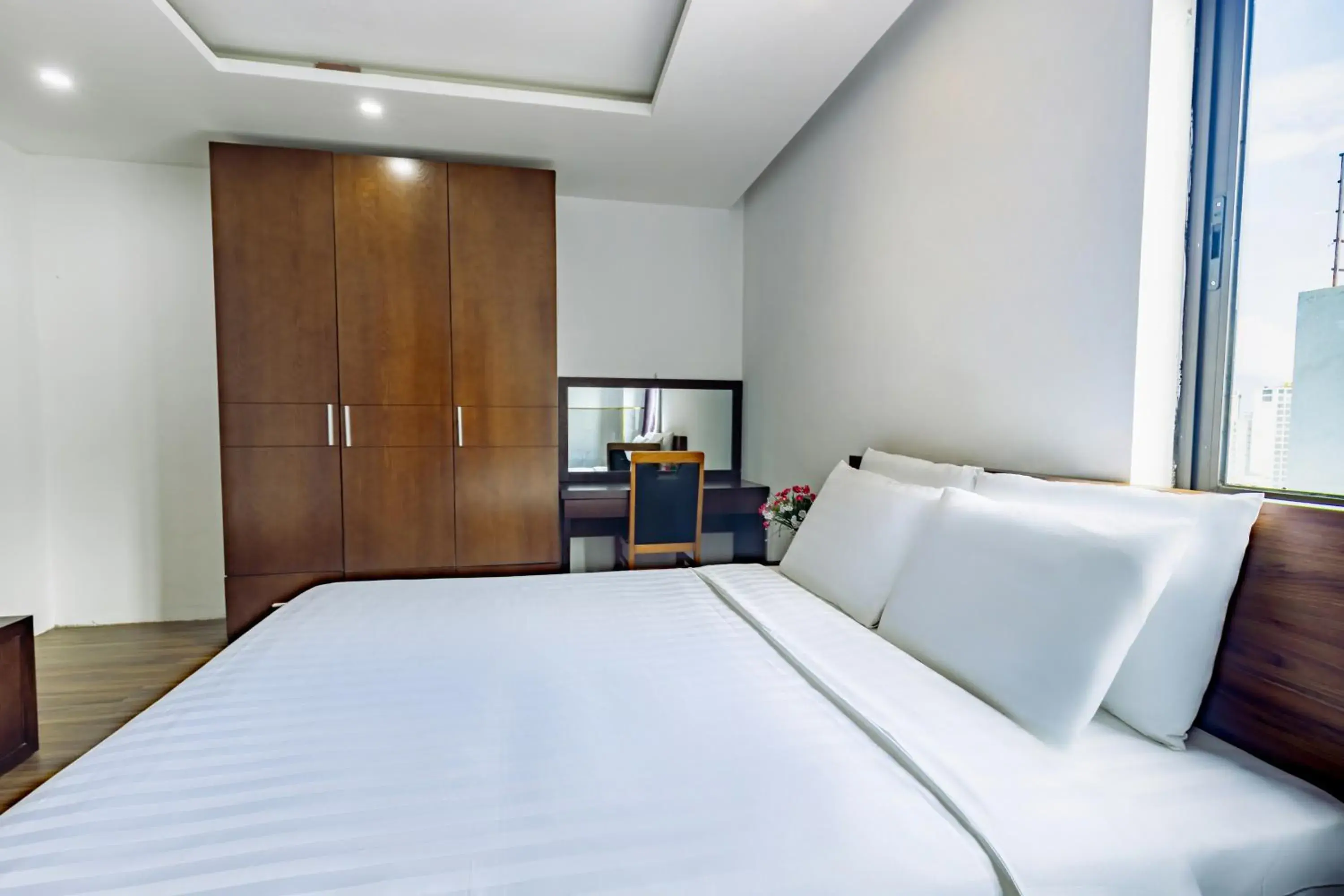 Bed in Golden Sun Apartment by New Sky Travel Bed in Golden Sun Apartment by New Sky Travel