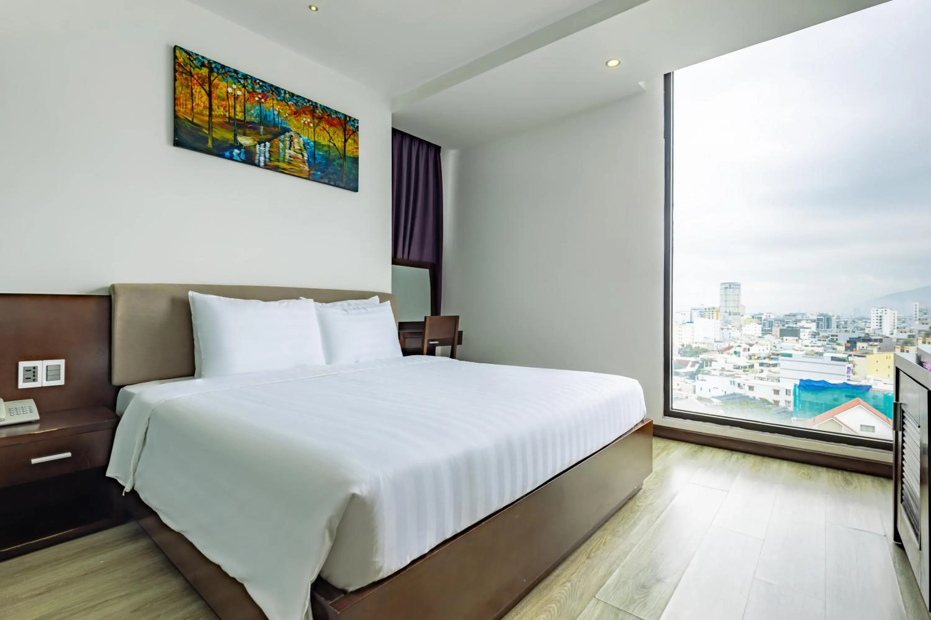 Bed in Golden Sun Apartment by New Sky Travel