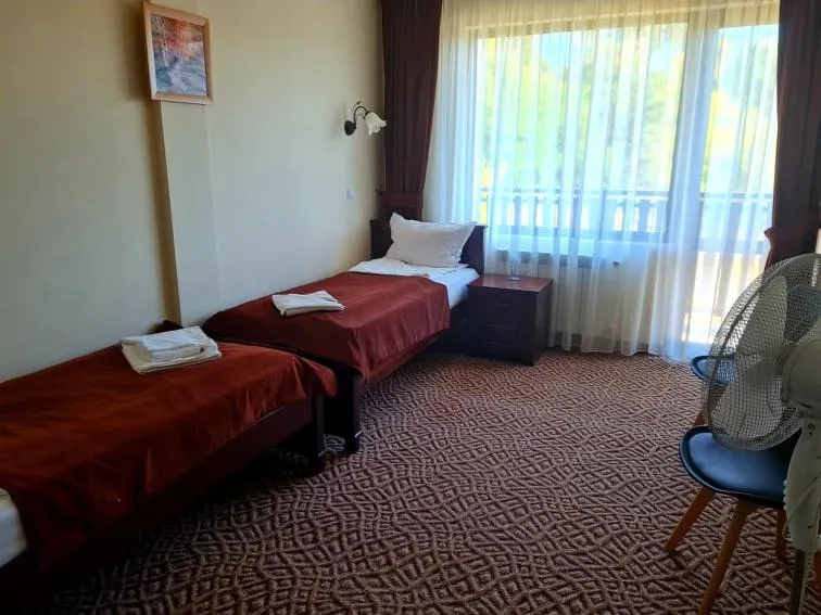 Bed in Family Hotel Bela