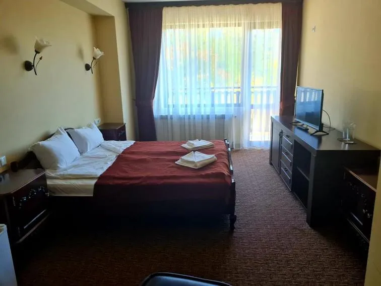 Bed in Family Hotel Bela