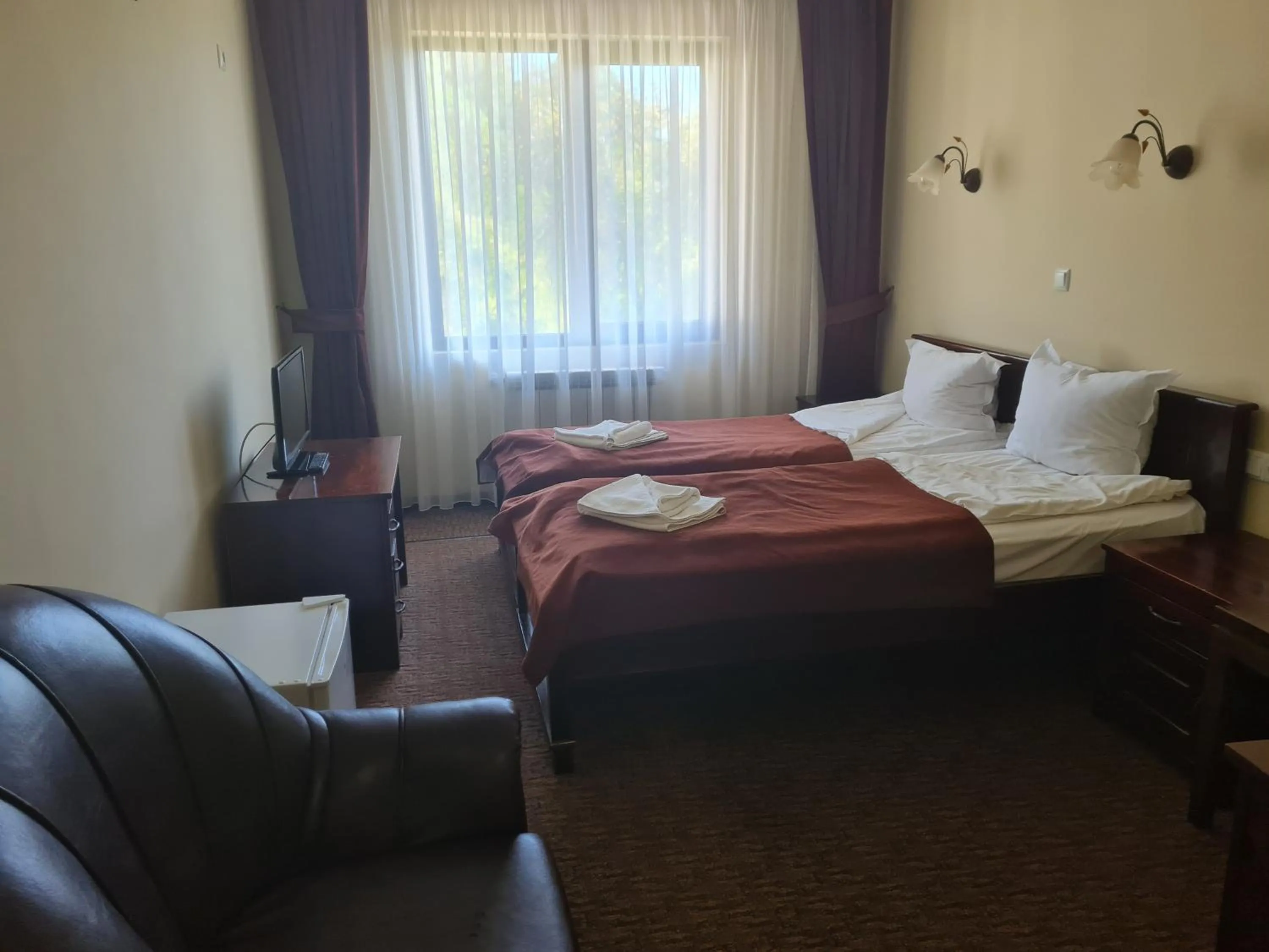 Bed in Family Hotel Bela