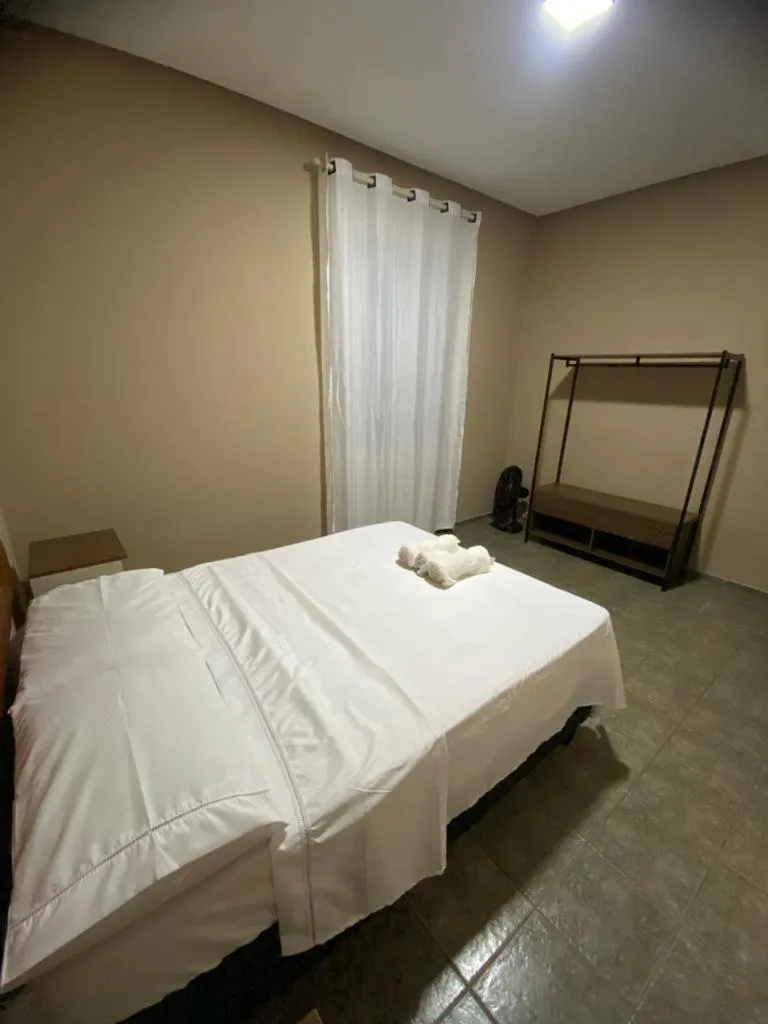 Bed in Pousada Caminho do Ribeirão