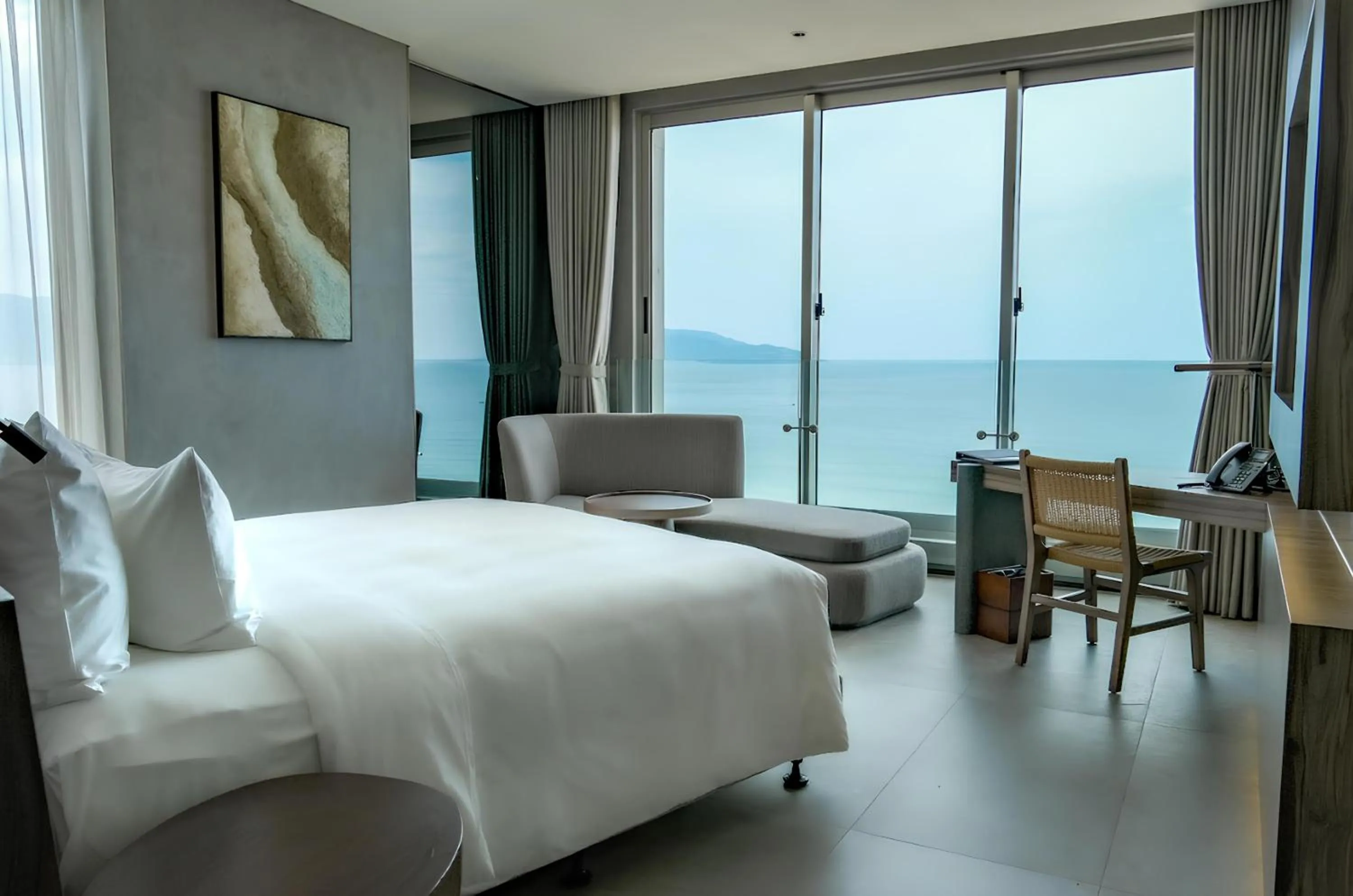 Seating area, Bed in M Hotel Danang