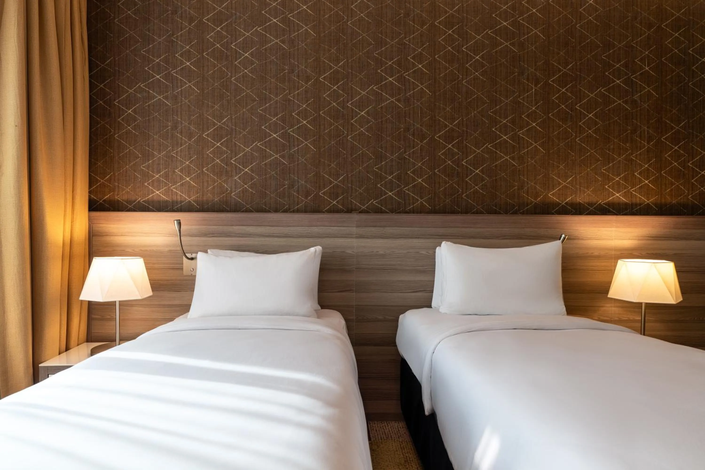 Bed in Mercure Makkah Aziziah