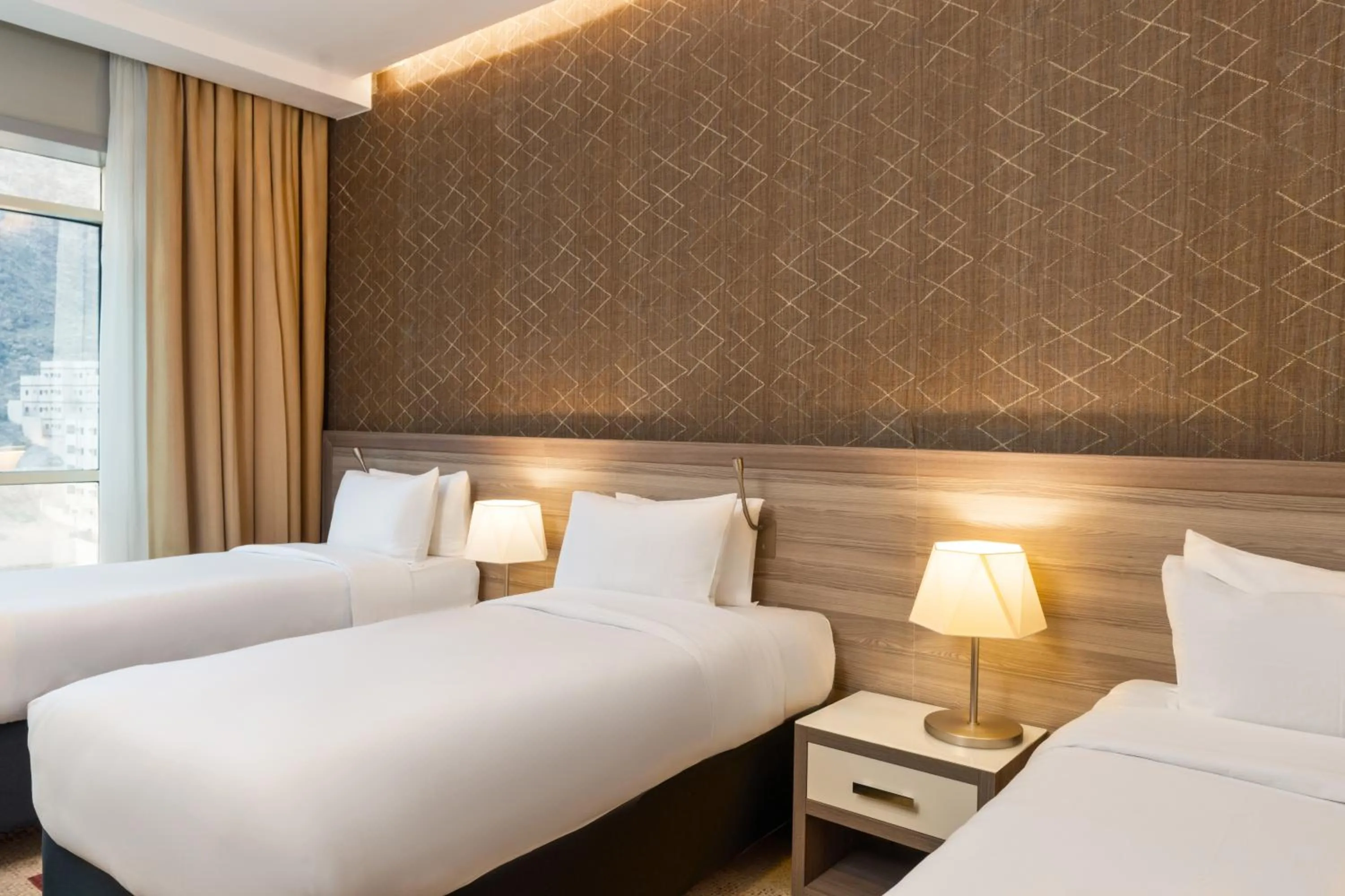 Bed in Mercure Makkah Aziziah