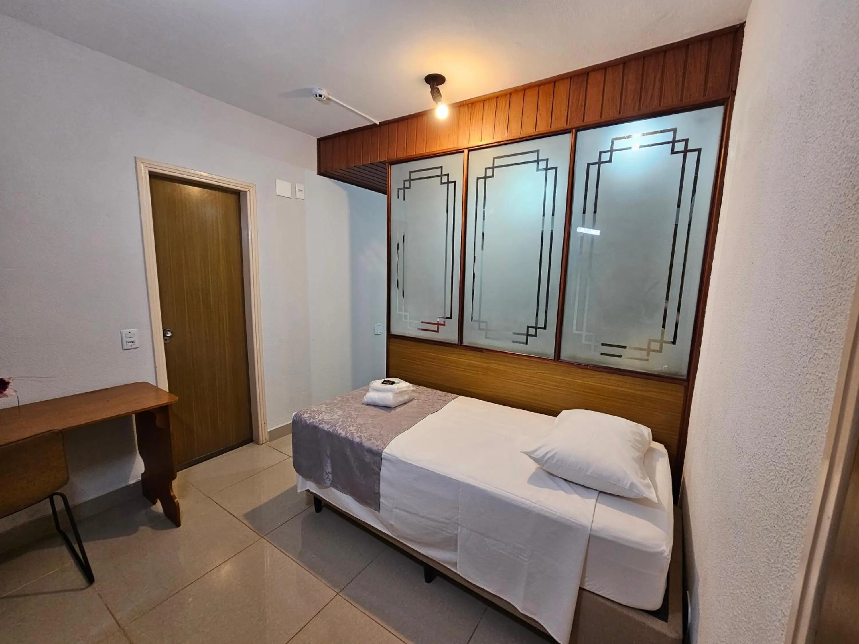 Bed in Optimum Plaza Hotel