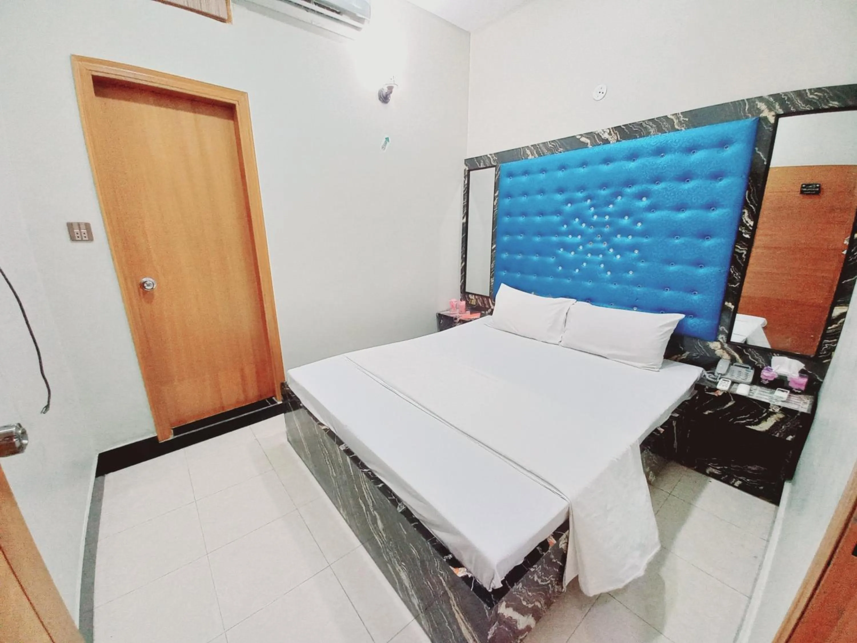 Bed in Rose Palace Guest House