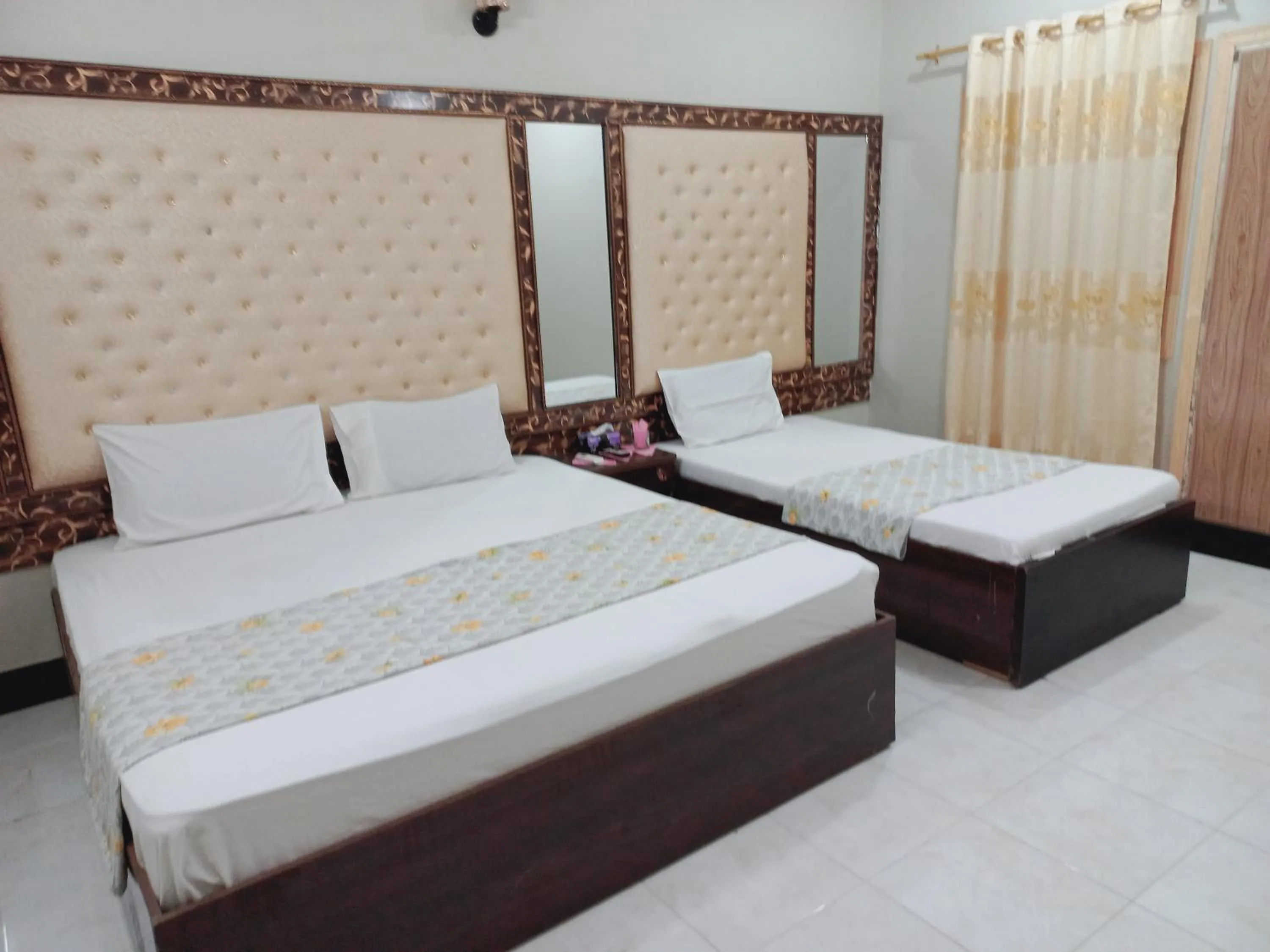 Bed in Rose Palace Guest House