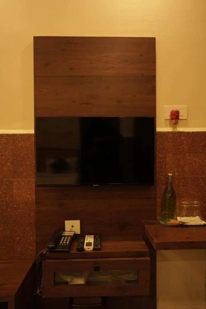 Communal lounge/ TV room in Kovilakam Achutham