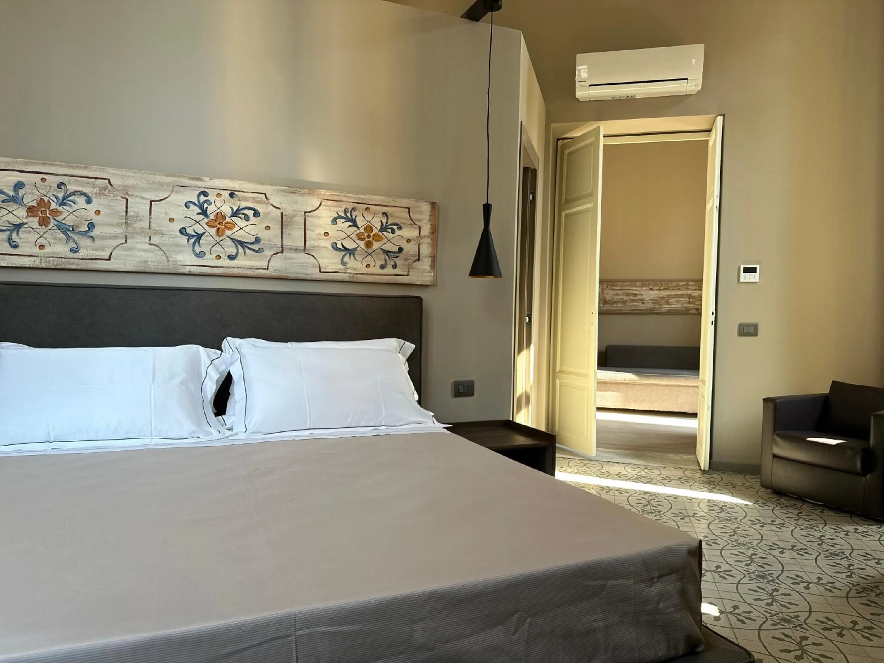 Photo of the whole room, Bed in Palazzo Liberty Unique Hotel by Geocharme