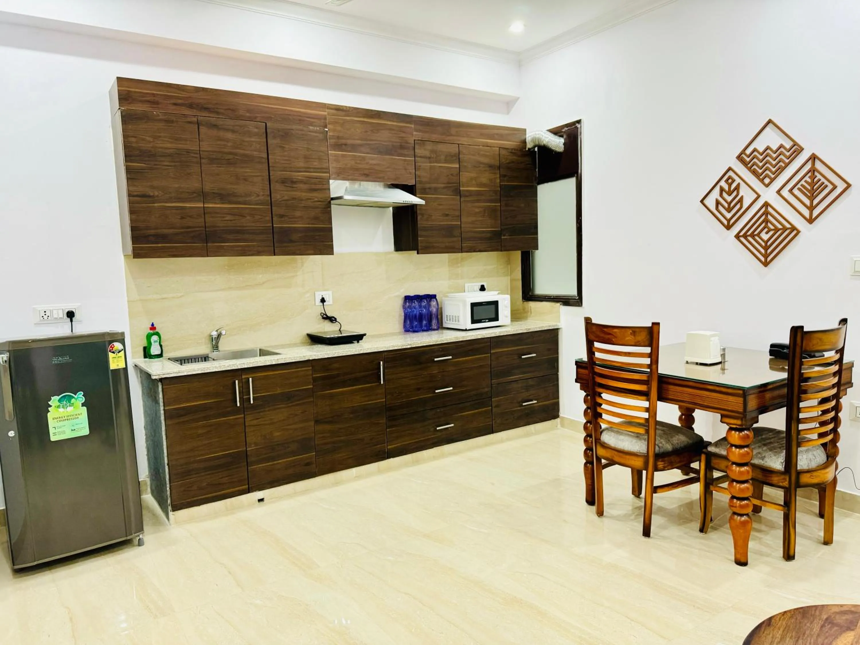 Kitchen or kitchenette in ZEN Suites - Golf Course Road Gurgaon