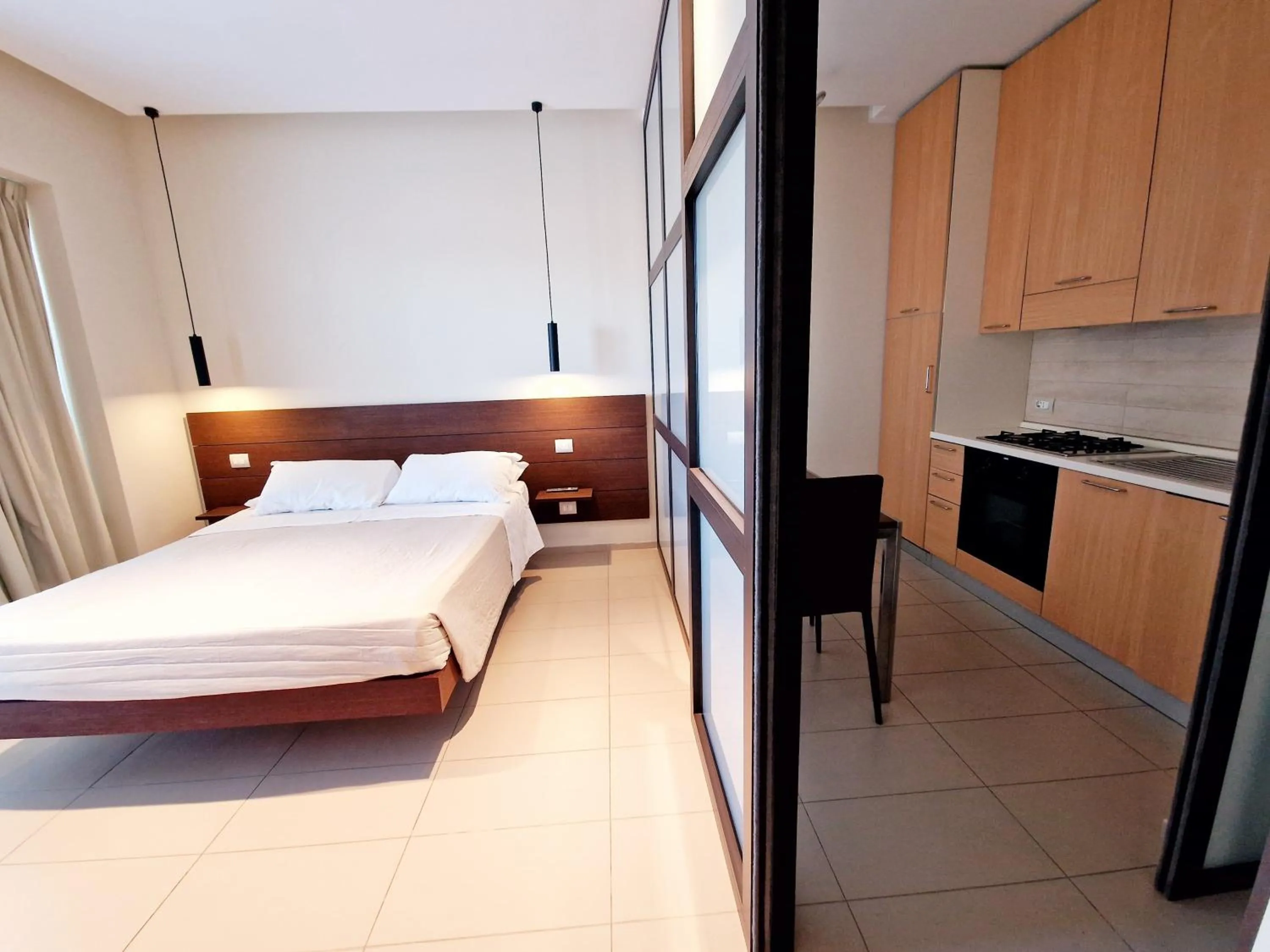 Kitchen or kitchenette, Bed in Martur Resort