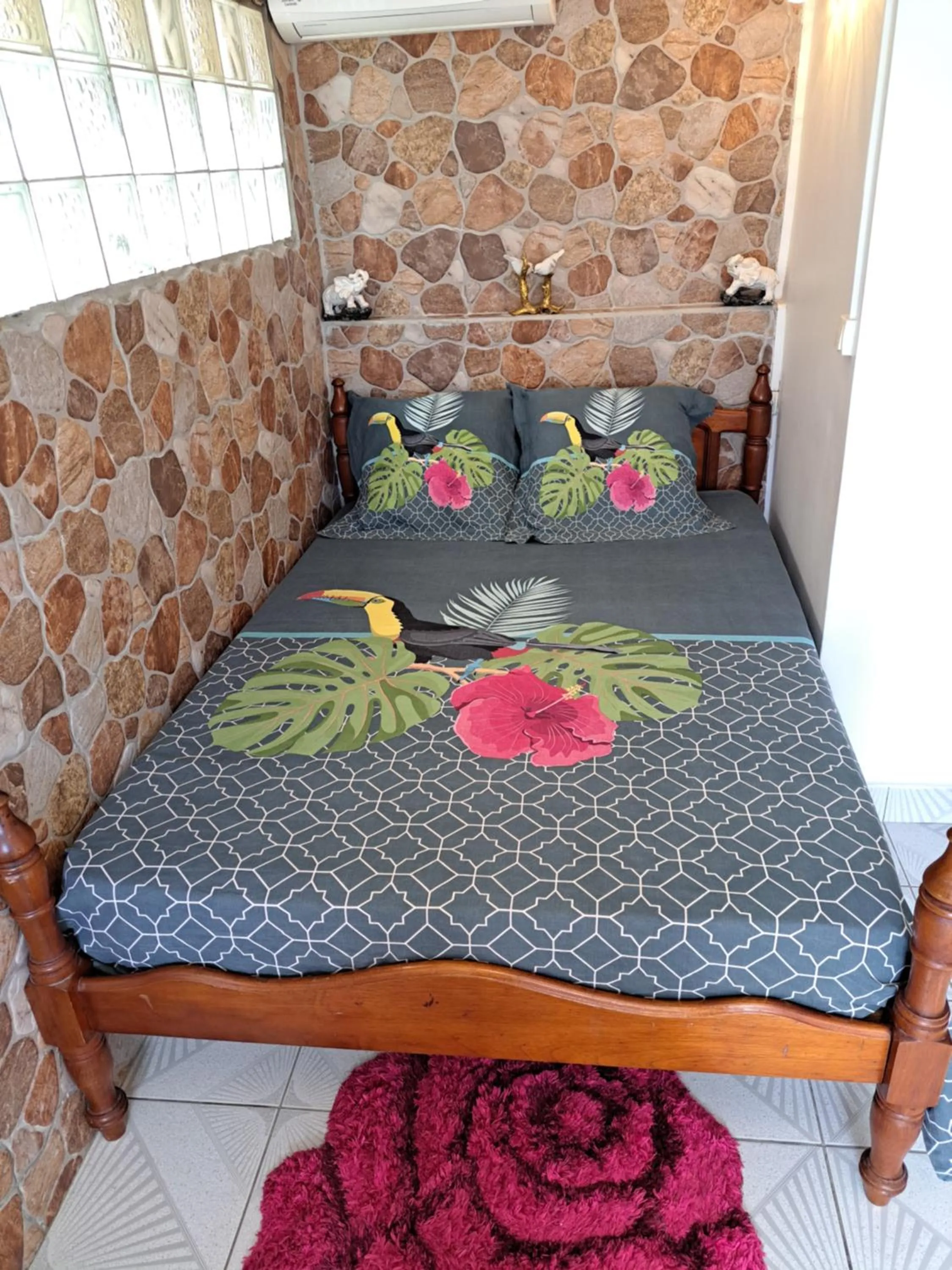 Bed in KANALU BEACH APPATEMENT