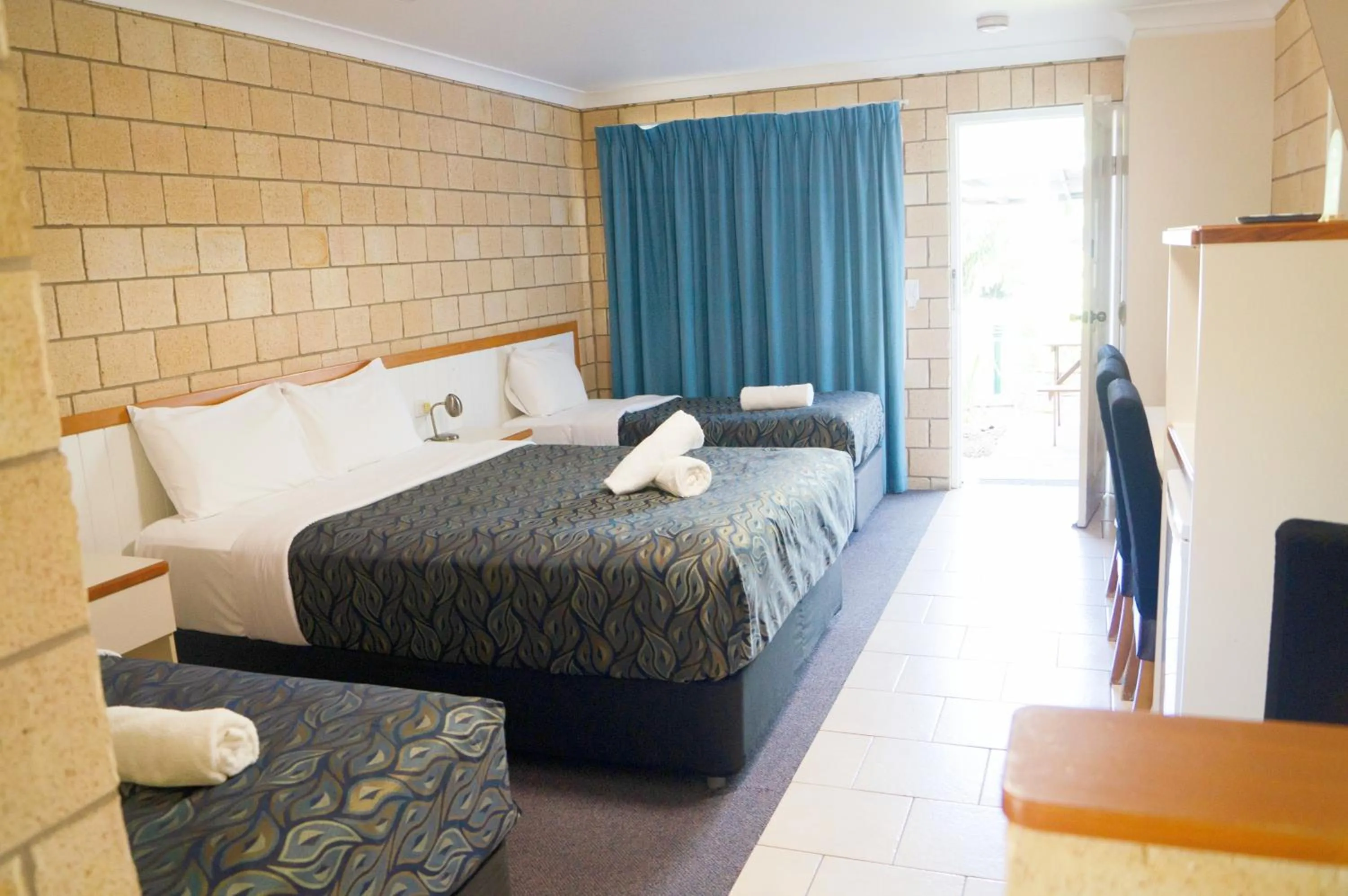 Bed in Jacaranda Country Motel
