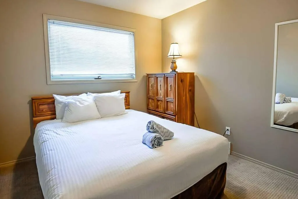 Bed in Thunder Ridge Chalet by Fernie Lodging Company