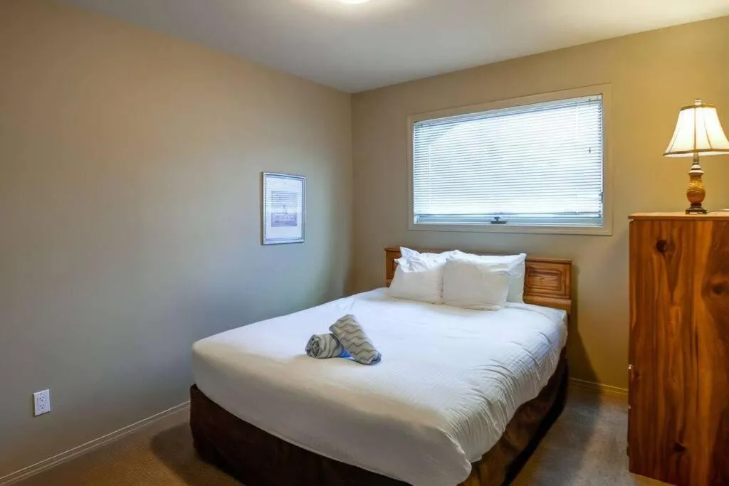 Bed in Thunder Ridge Chalet by Fernie Lodging Company