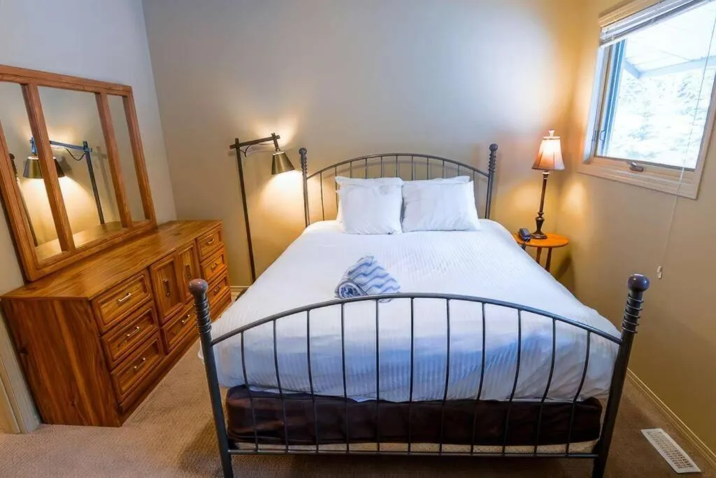 Bed in Thunder Ridge Chalet by Fernie Lodging Company
