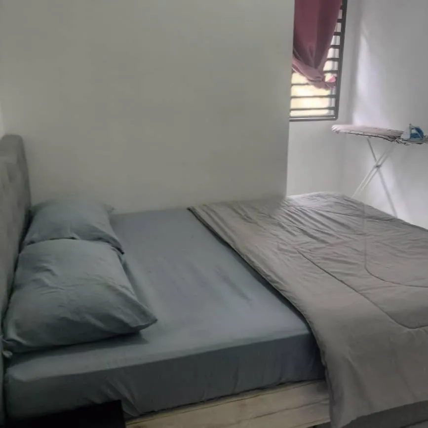 Bed in Barakah Sufi Home Stay Apartment Cameron