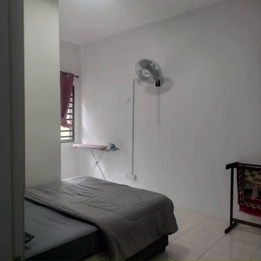 Bed in Barakah Sufi Home Stay Apartment Cameron