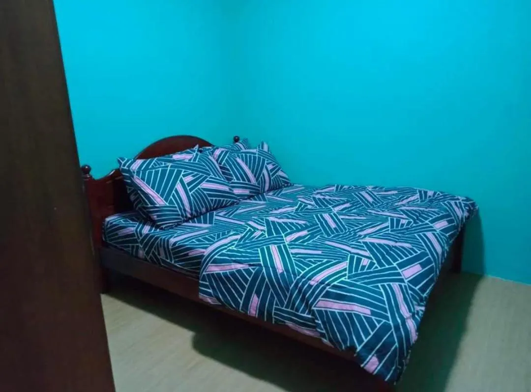 Bed in Barakah Sufi Home Stay Apartment Cameron