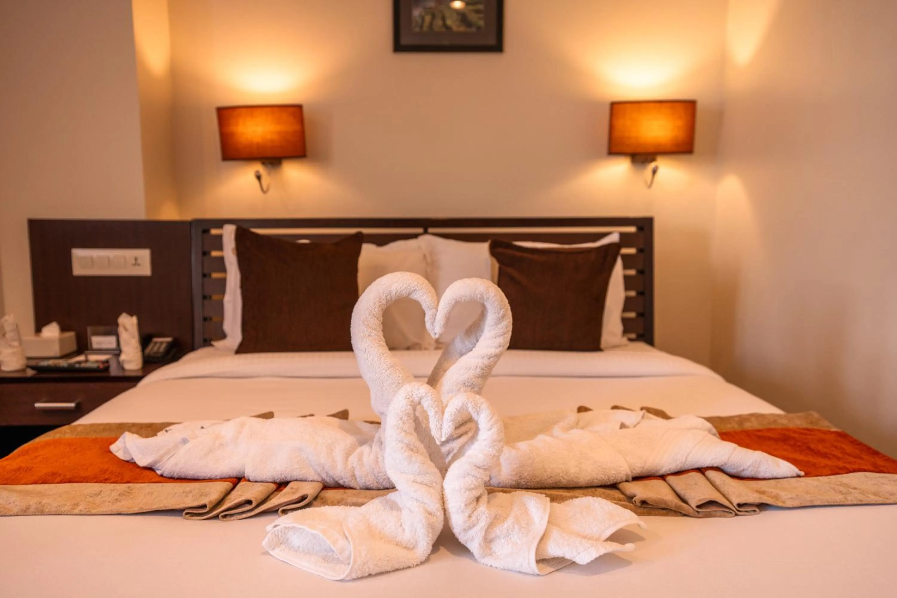 Bed in The Luxe Inn Boutique Hotel