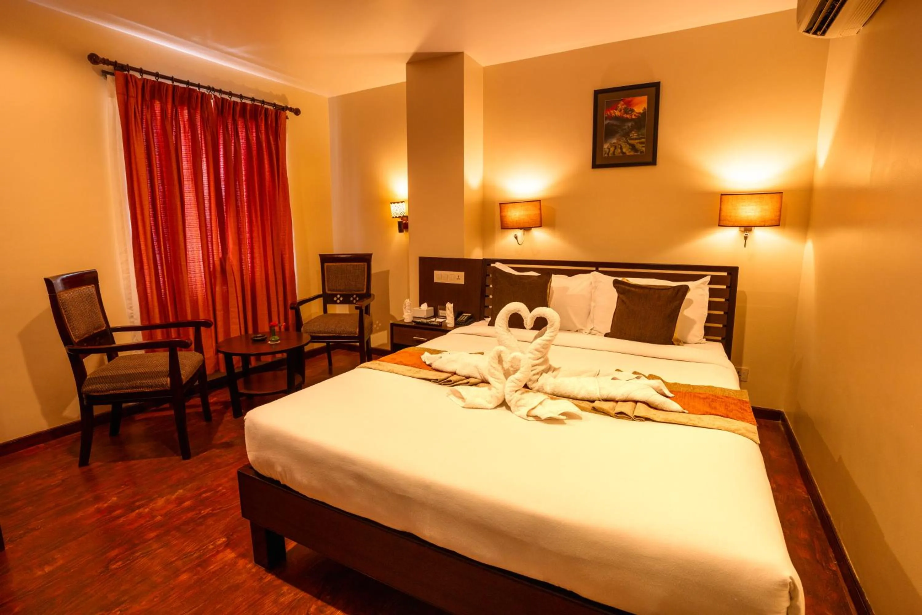 Bed in The Luxe Inn Boutique Hotel