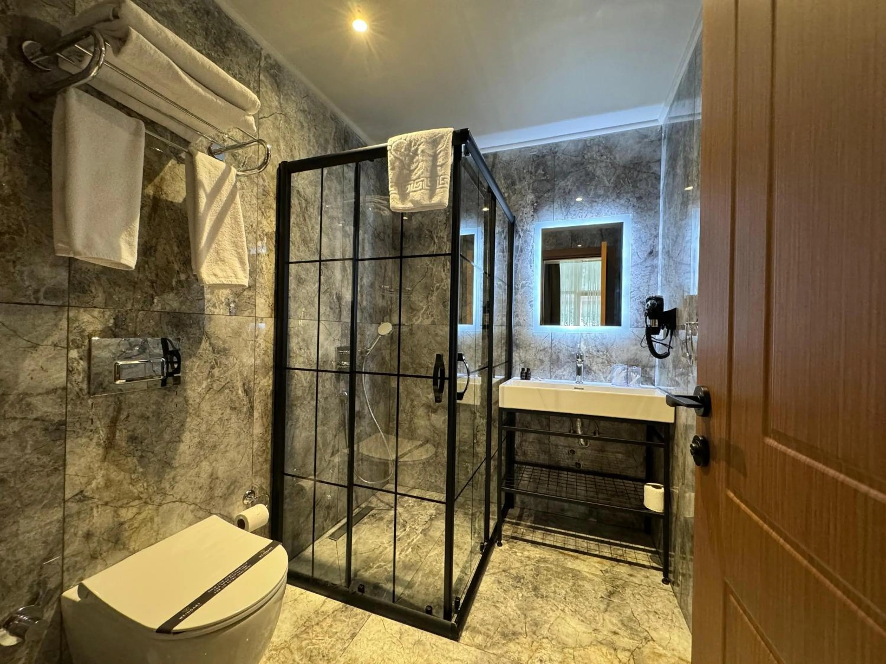 Toilet in Weingart Suites Hotel