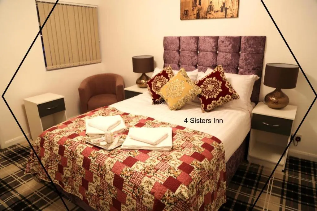 Bedroom in OYO 4 Sisters Inn