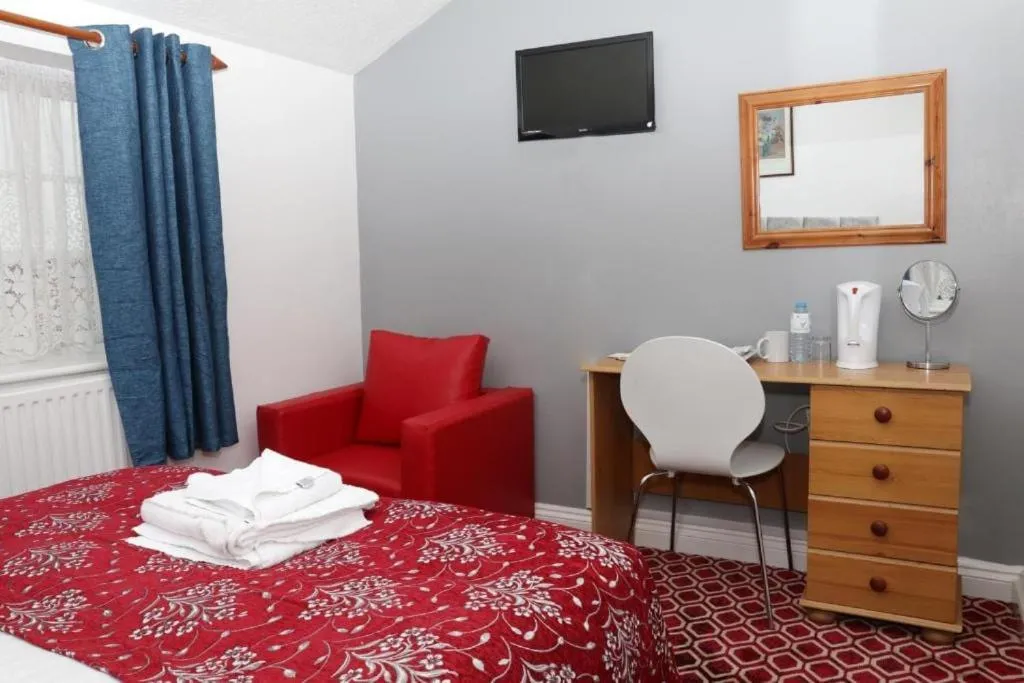 Bedroom in OYO 4 Sisters Inn