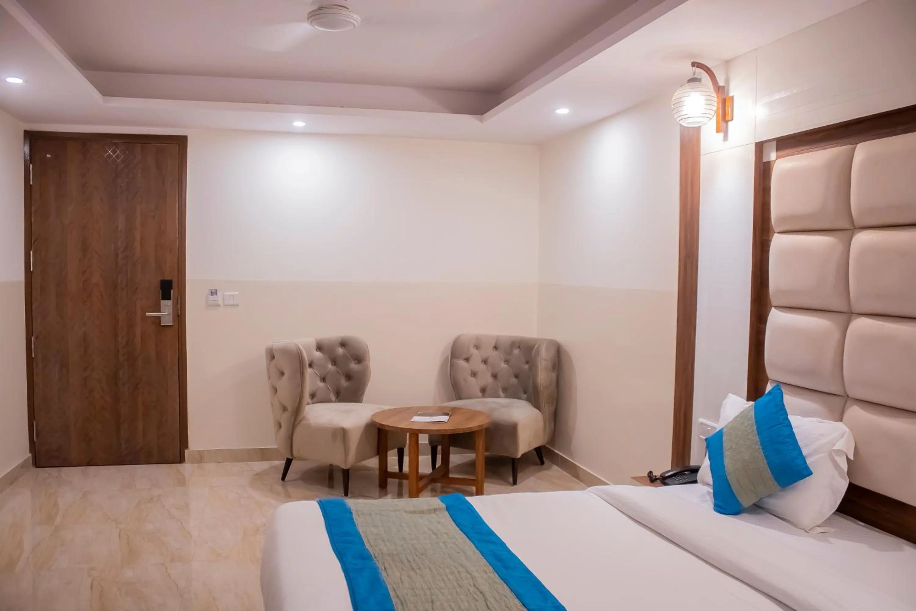 Bed, Seating Area in Hotel Airport City Near Delhi International Airport