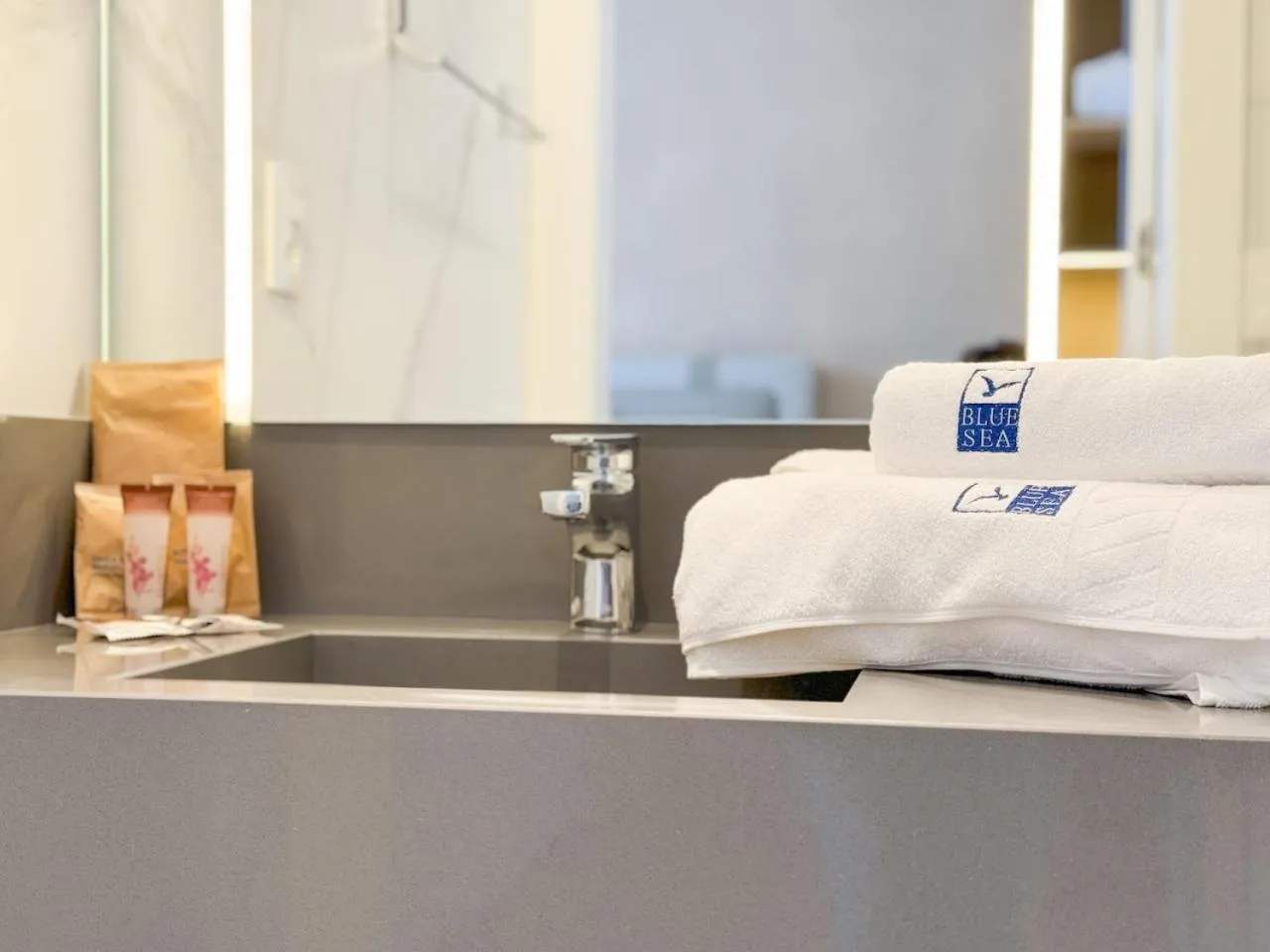 towels, Bed in Blue Sea Hotel
