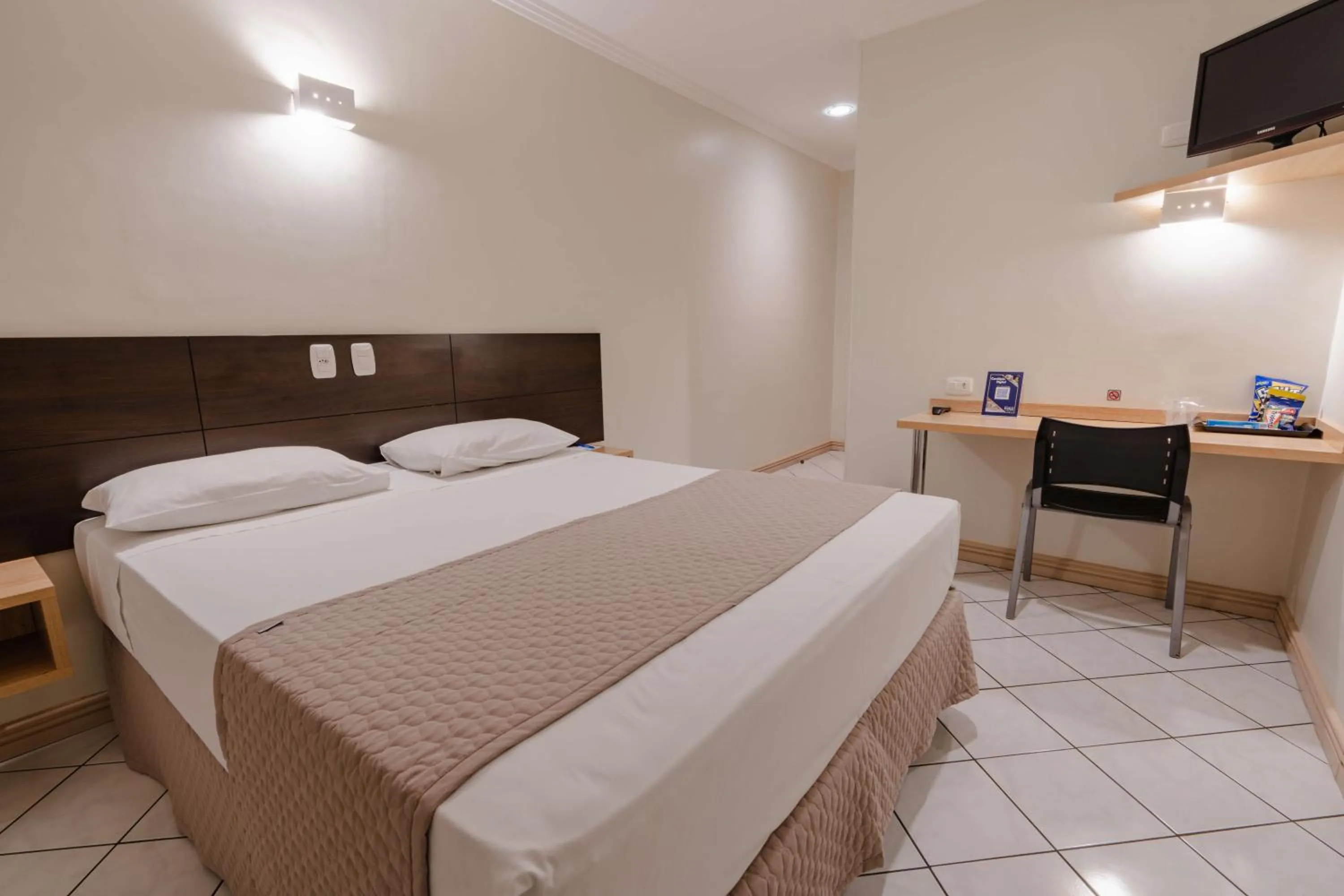 Bed in Hotel Caiuá Express Umuarama