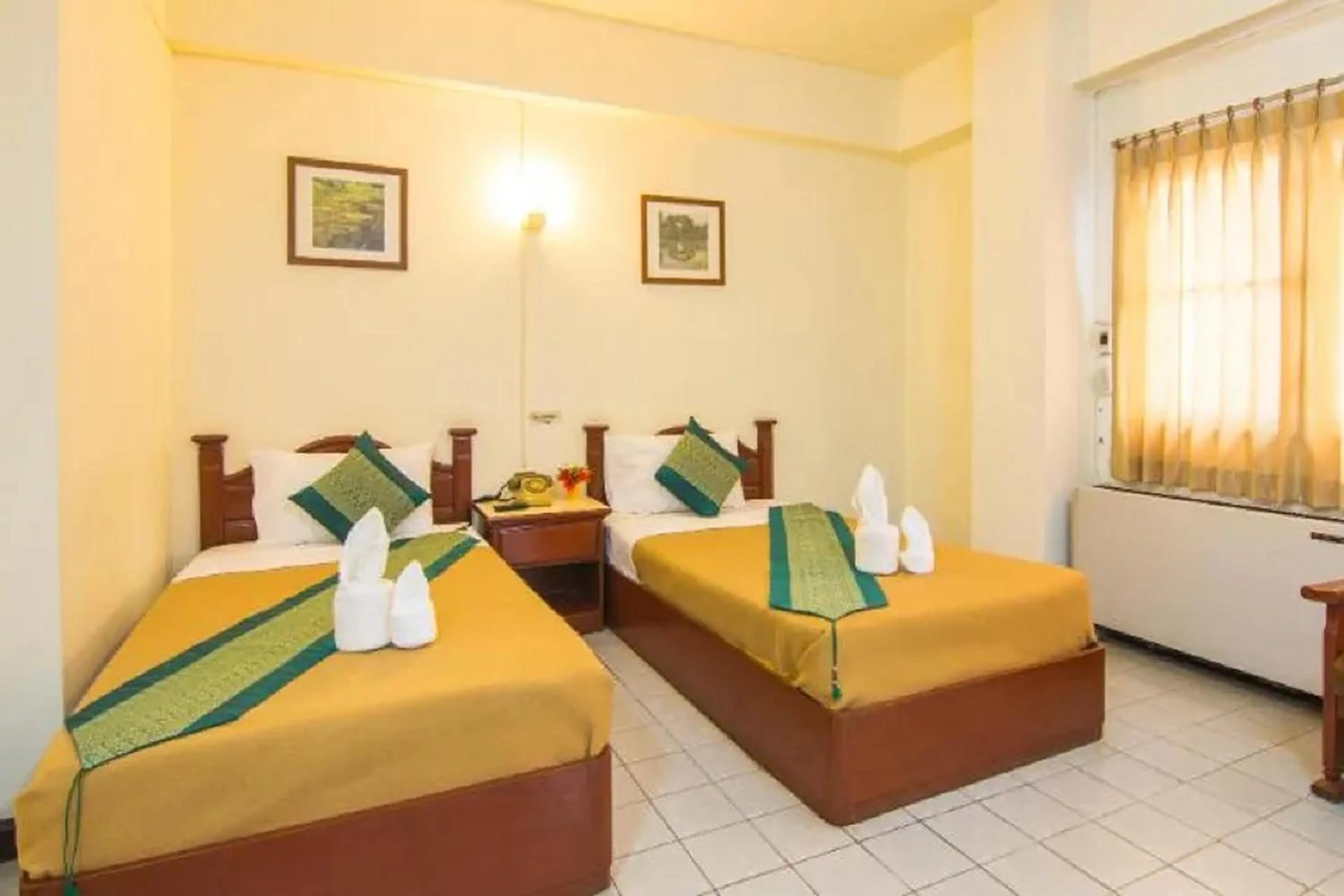 Bed in Khelang Nakorn Hotel