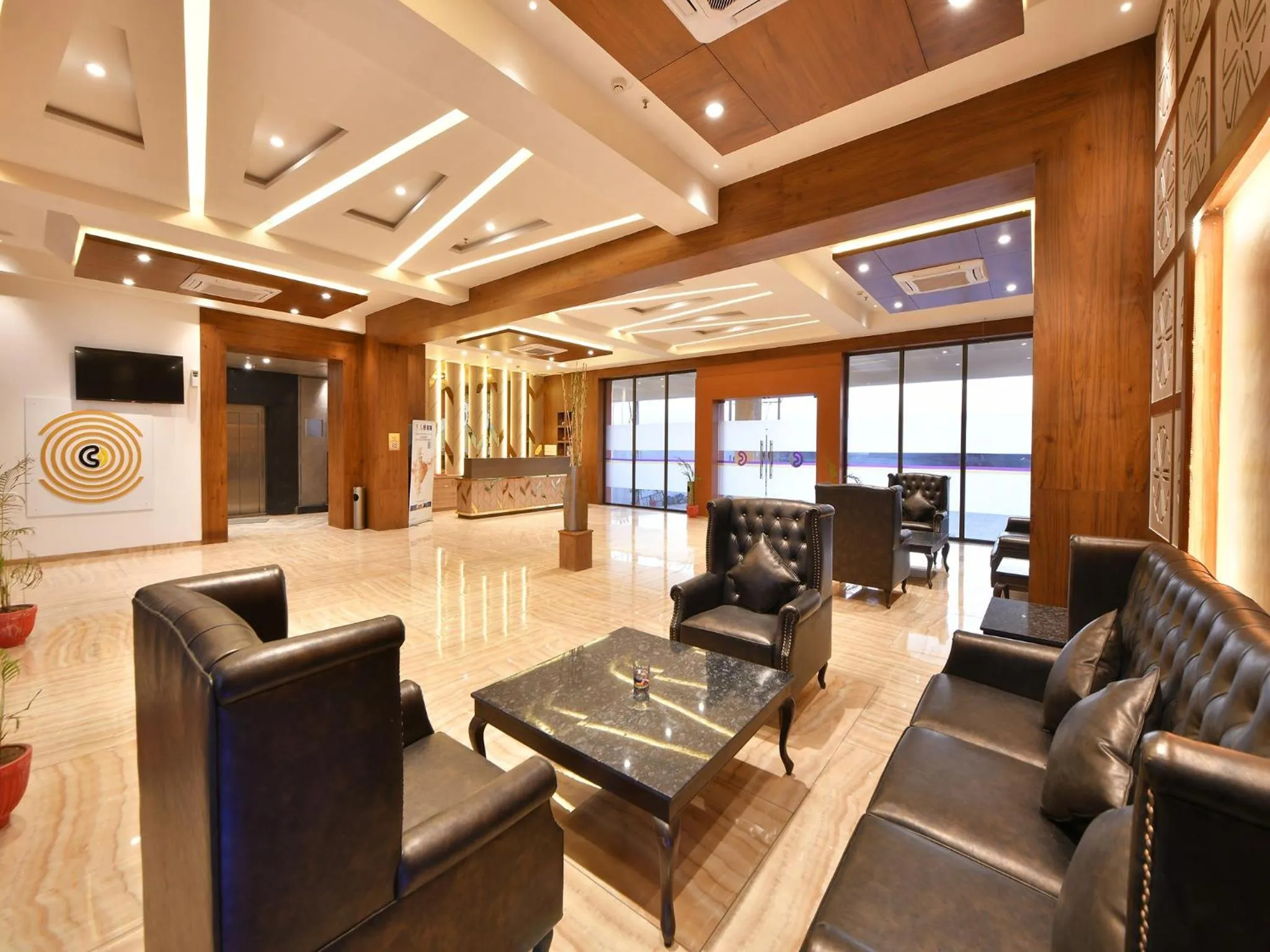Seating area in Clubhouse Hotel by CheckIn Morbi