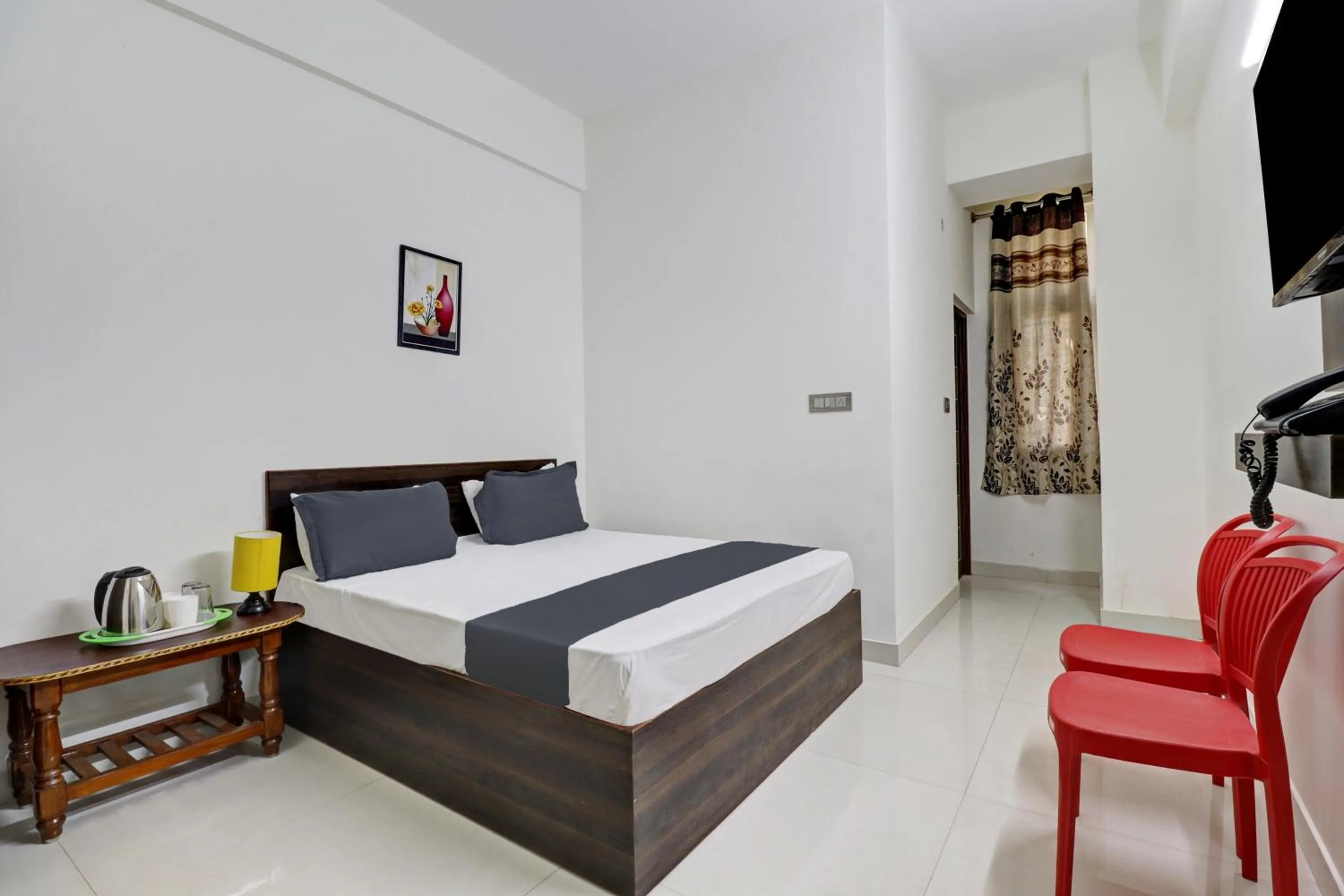 Bedroom in Hotel O J.K. Suites & Rooms