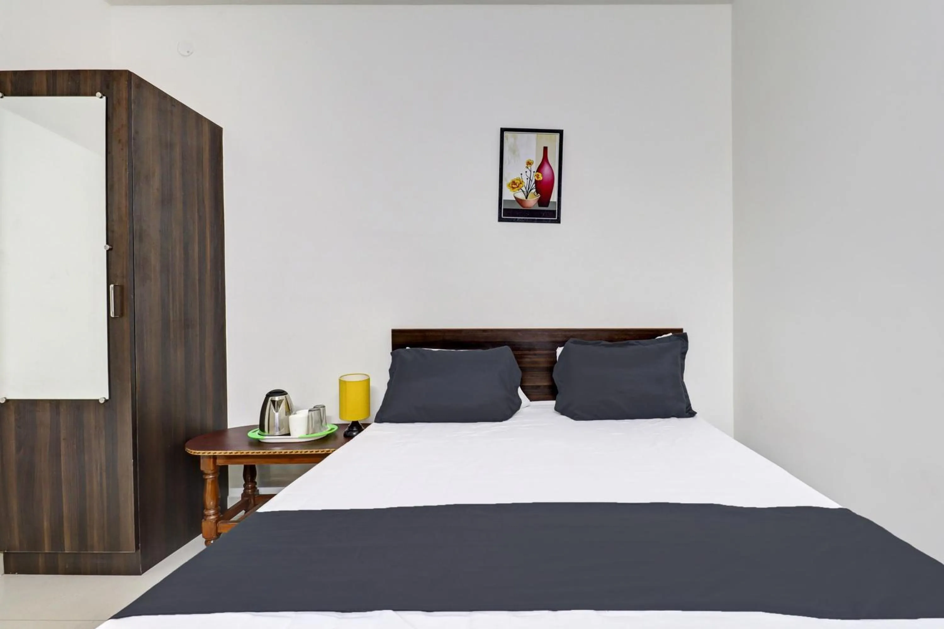 Bedroom in Hotel O J.K. Suites & Rooms