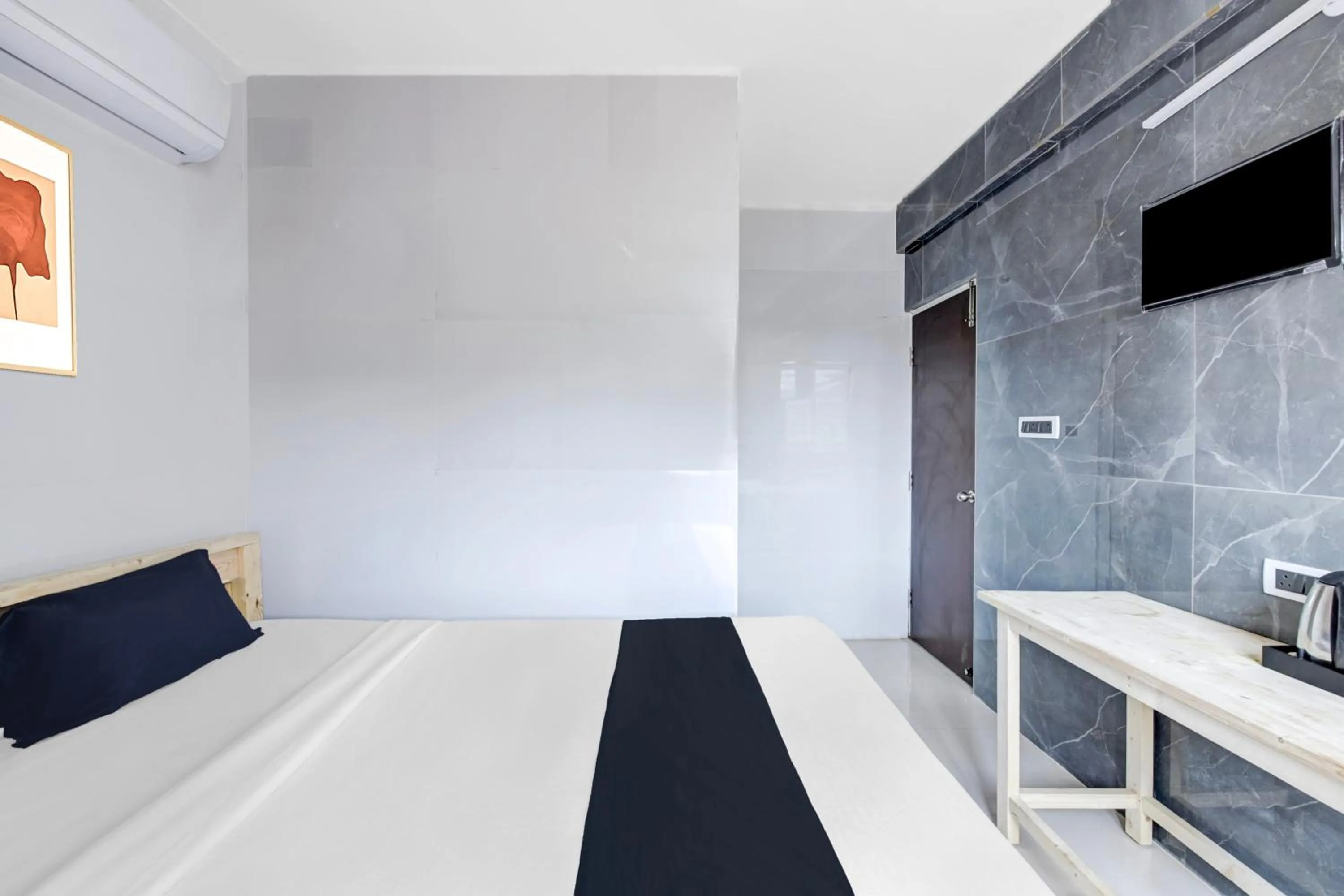 Bedroom in Collection O Sapthagiri Inn