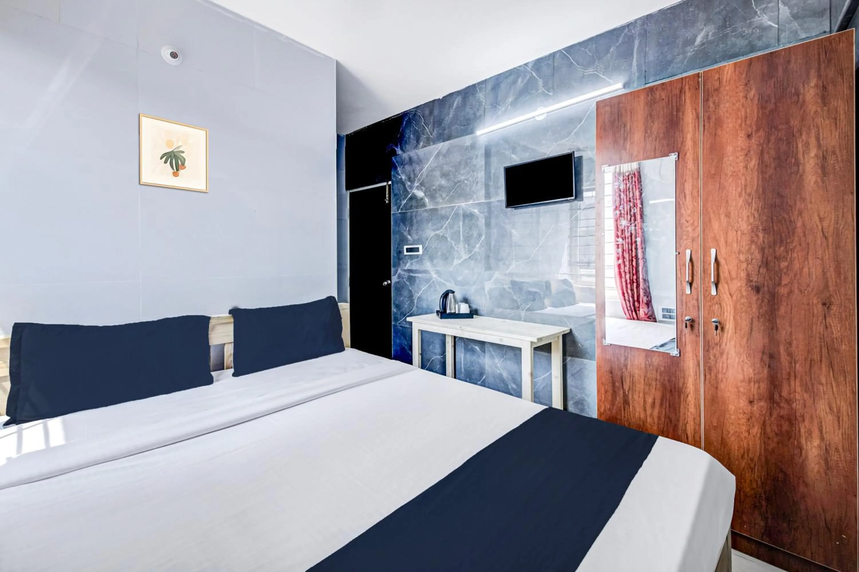 Bedroom in Collection O Sapthagiri Inn