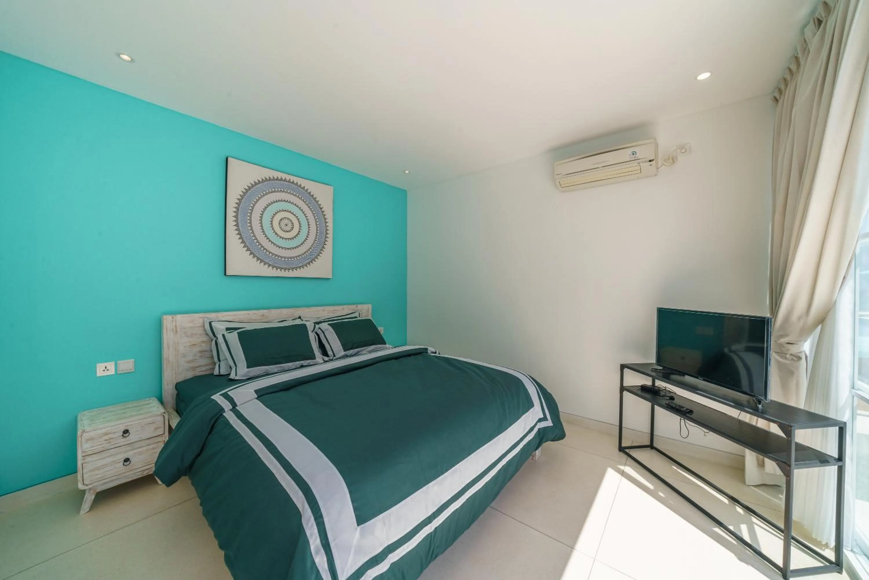 Bed in Abian Kapas Beach House