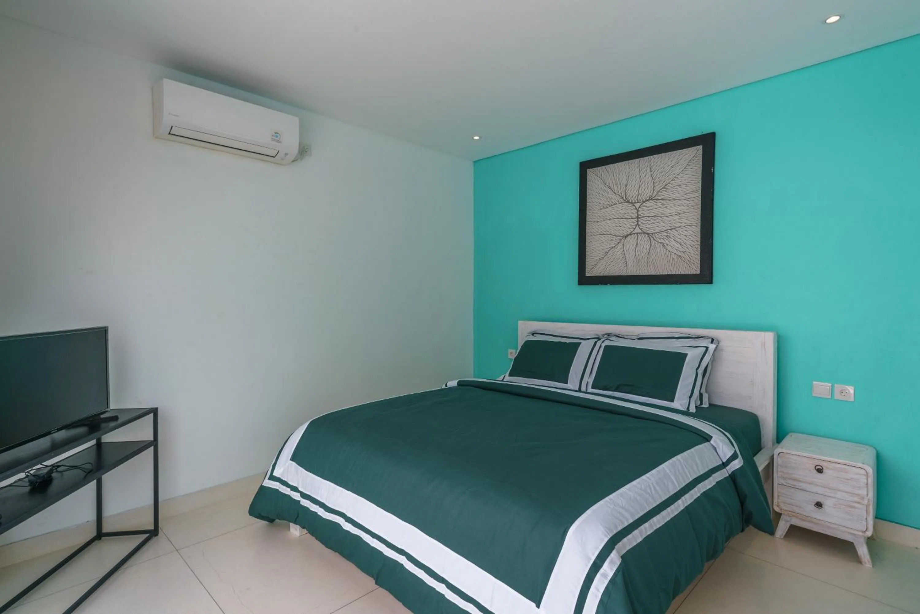 Bed in Abian Kapas Beach House