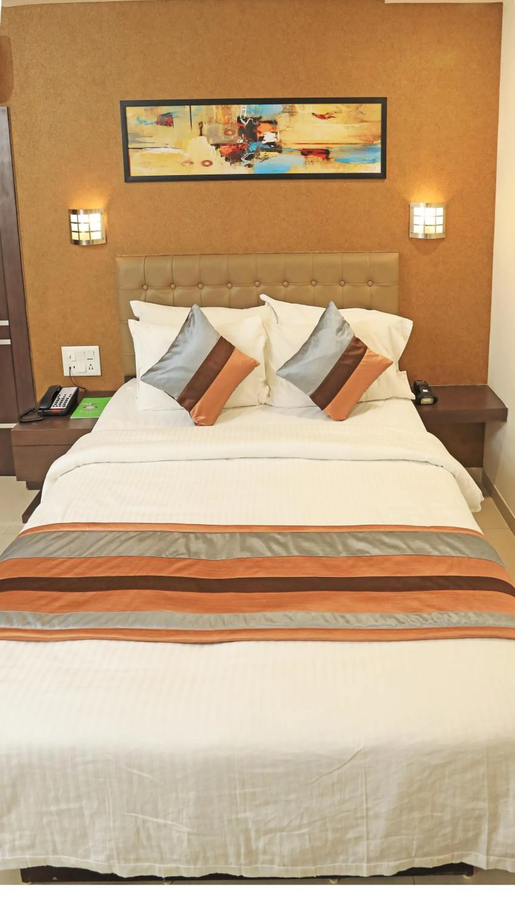 Bed in Click Hotel Yuvraj